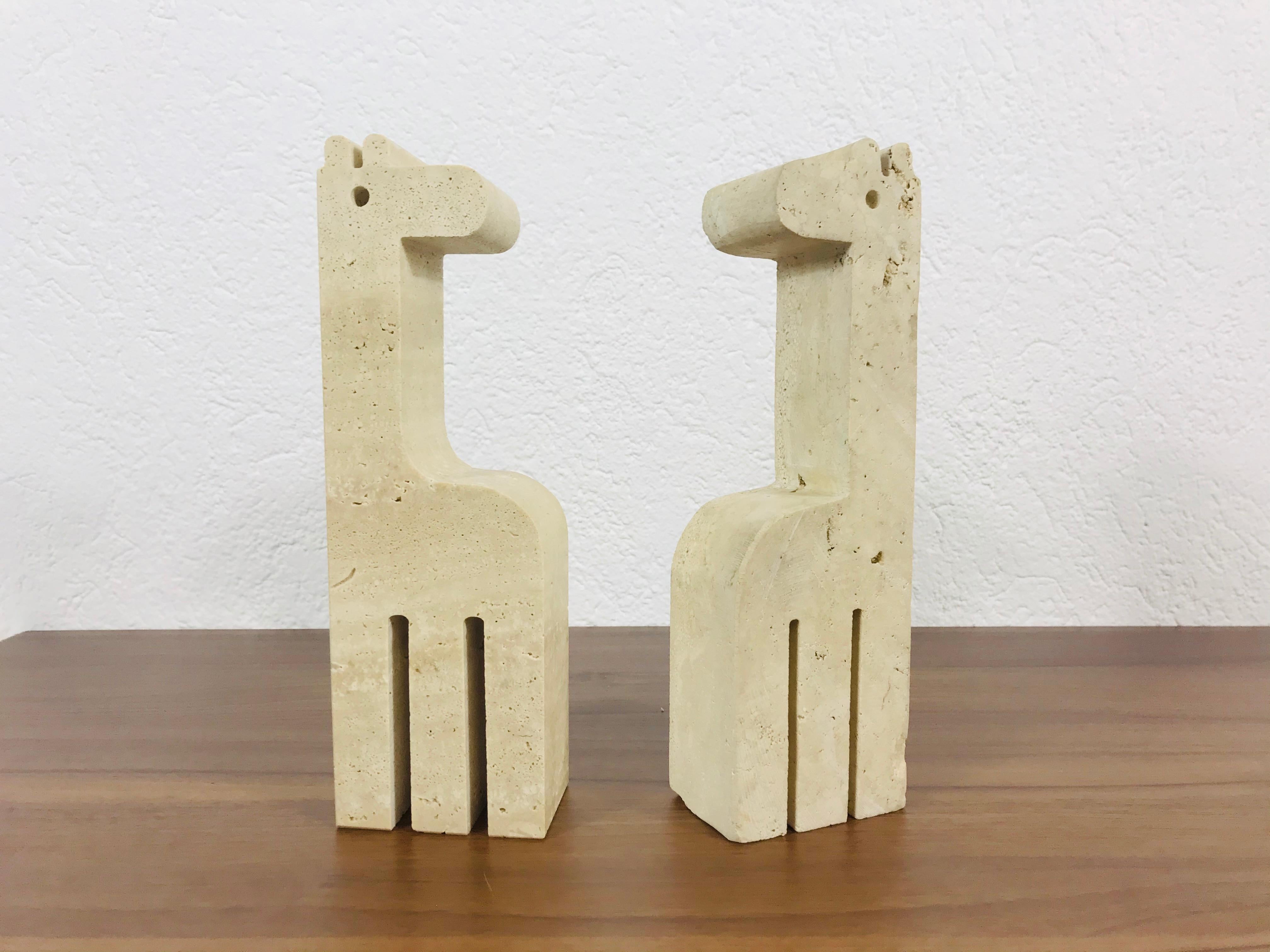 Wonderful pair of sculpture book ends by Fratelli Mannelli for Travertino di Rapolano. Giraffe shape travertine sculpture from the 1970s.