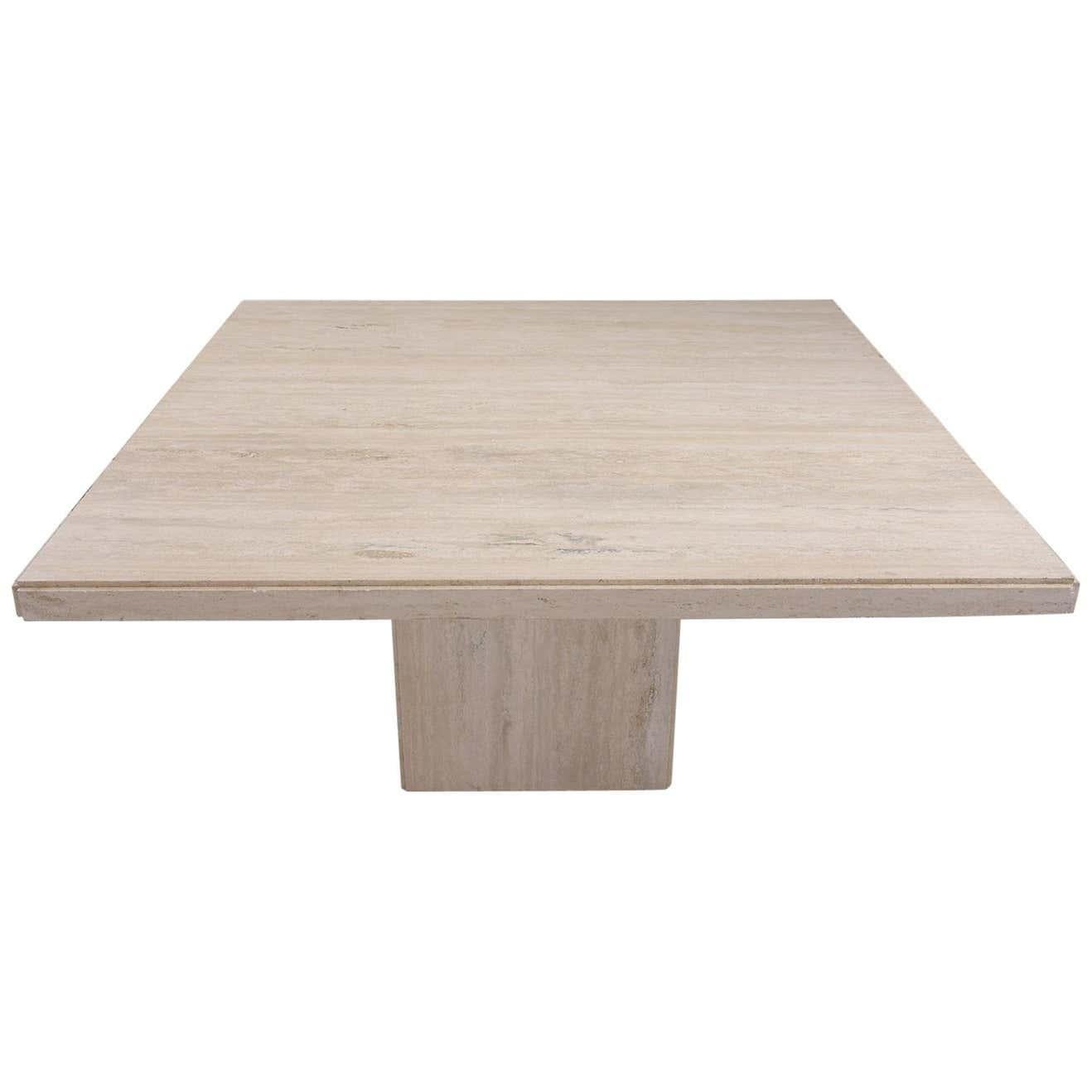 Experience the splendor of our extraordinary 1970s Italian travertine dining table, meticulously handcrafted out of top-quality travertine marble. Newly restored, this piece boasts a large, captivating square top with sophisticated rounded edges,