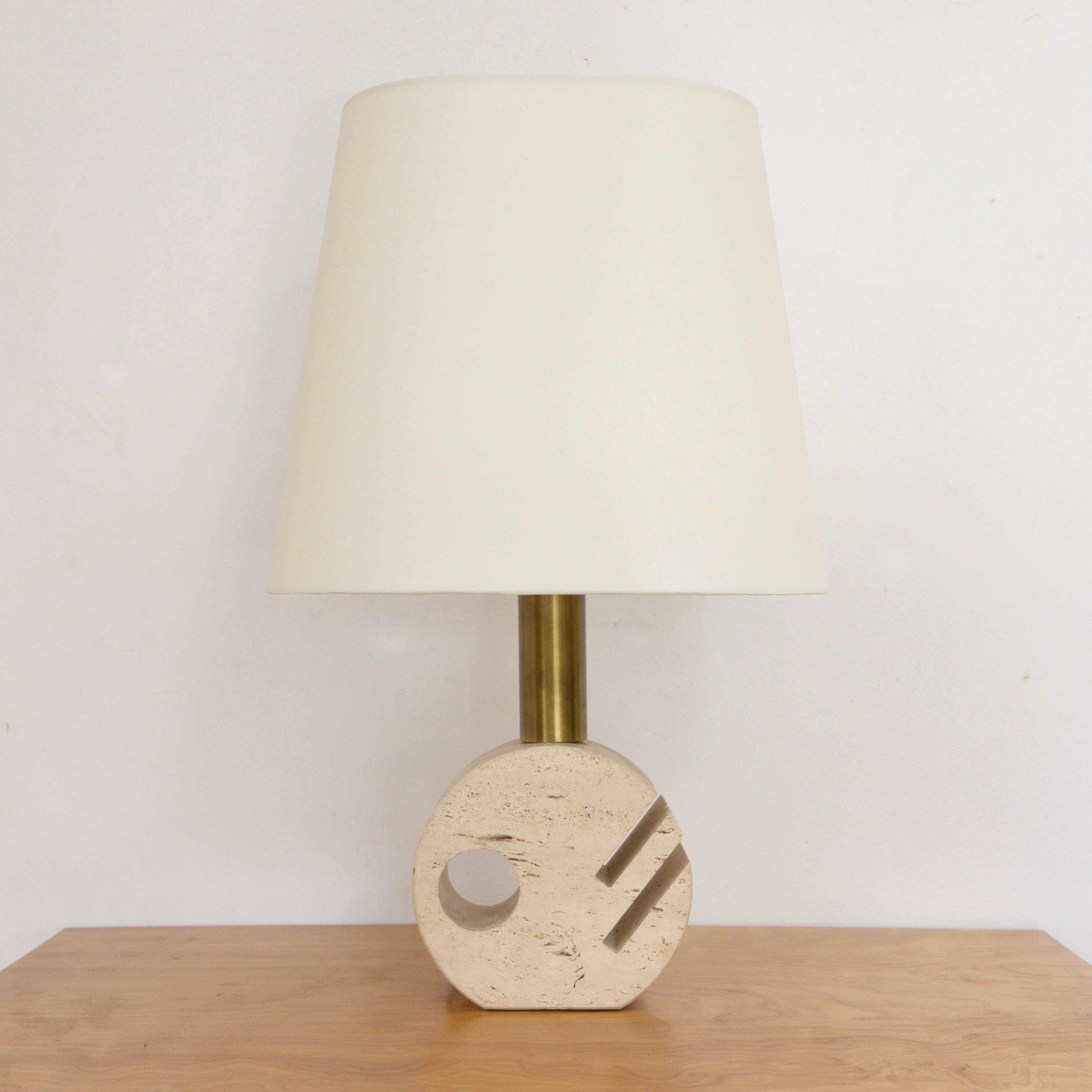 Vintage carved Italian circular travertine table lamp from the 1950s. Restored and fully rewired with a single E26 medium based socket, ready to be used in the USA. Lightbulbs included with order. 
Measurements:
Height: 26”
Shade diameter: