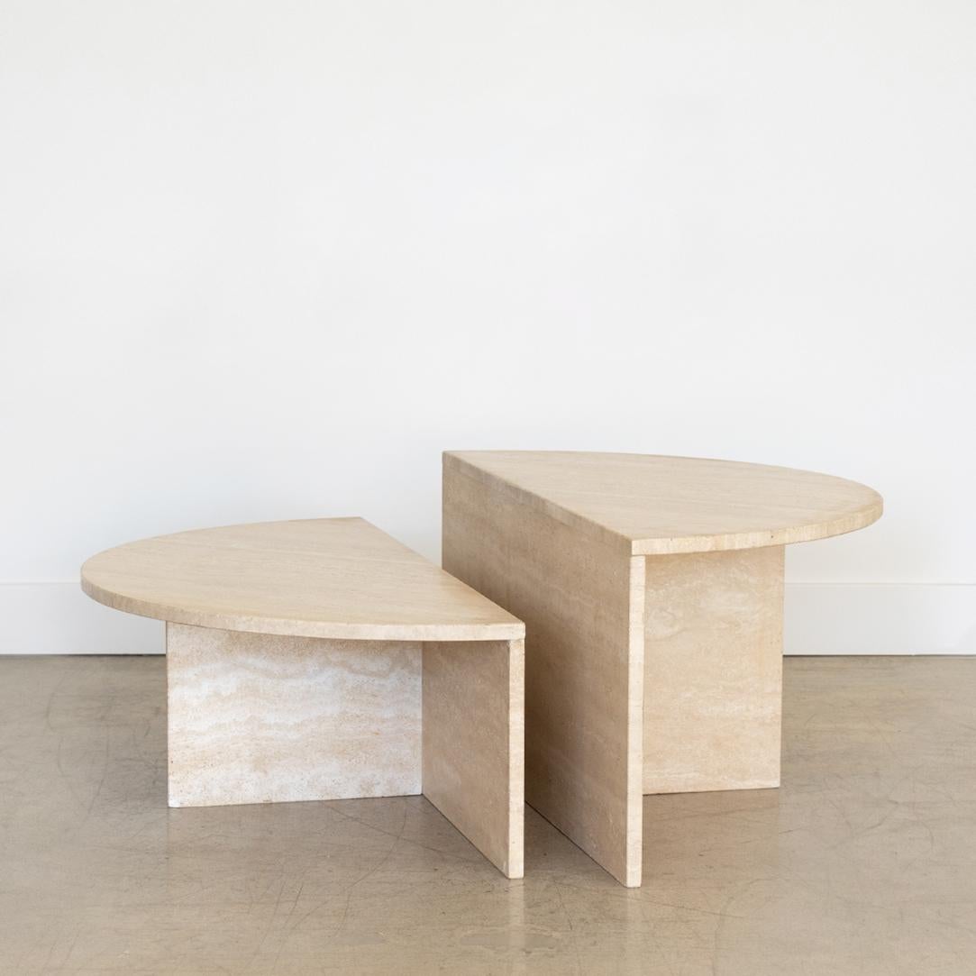 Vintage travertine circular coffee table from Italy, 1970's. Two separate tables in semi-circle shape with staggering heights. Can be placed in a variety of positions. Beautiful and functional piece. 

Two table heights measures 16” H and 12”