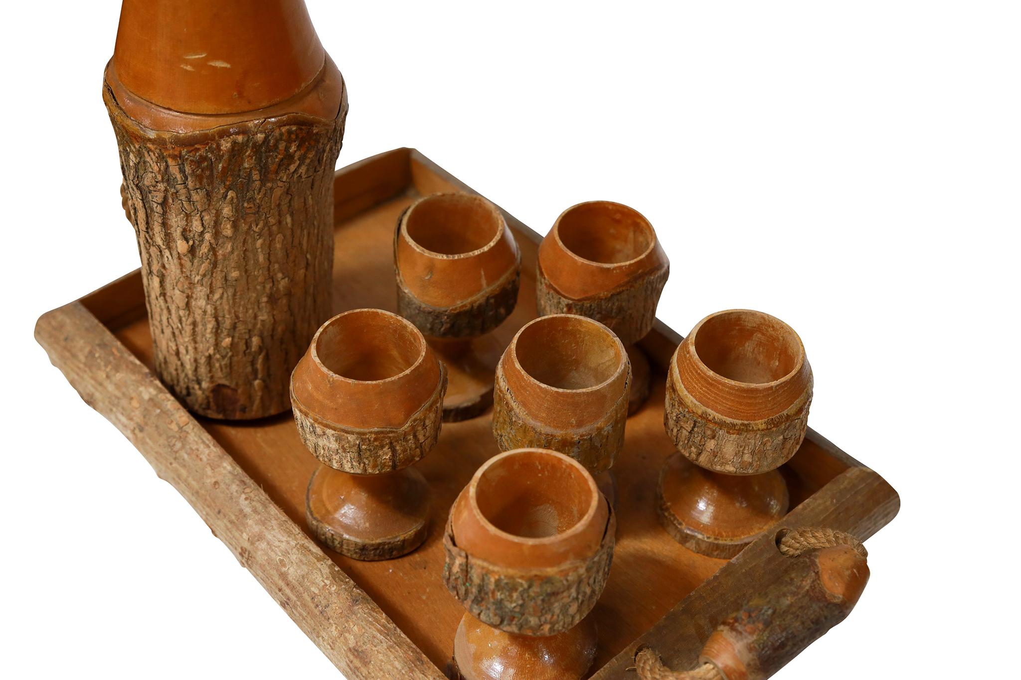 Italian Tray, Pitcher, & Cups Carved From a Tree. Great for your cabin or lodge. Circa 1950.

Dimensions:

Tray: 15 3/8