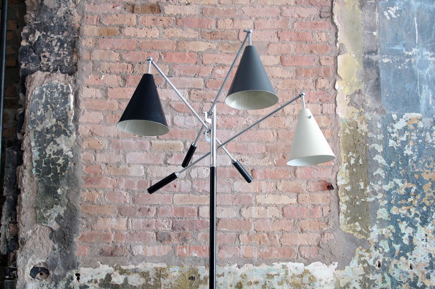 Arredoluce marble base three-arm design from the Milan Triennale of 1951. Features three different colored enameled metal shades in black, grey and white, along with leather handle grips and chrome-plated, articulating arms.

Marked made in