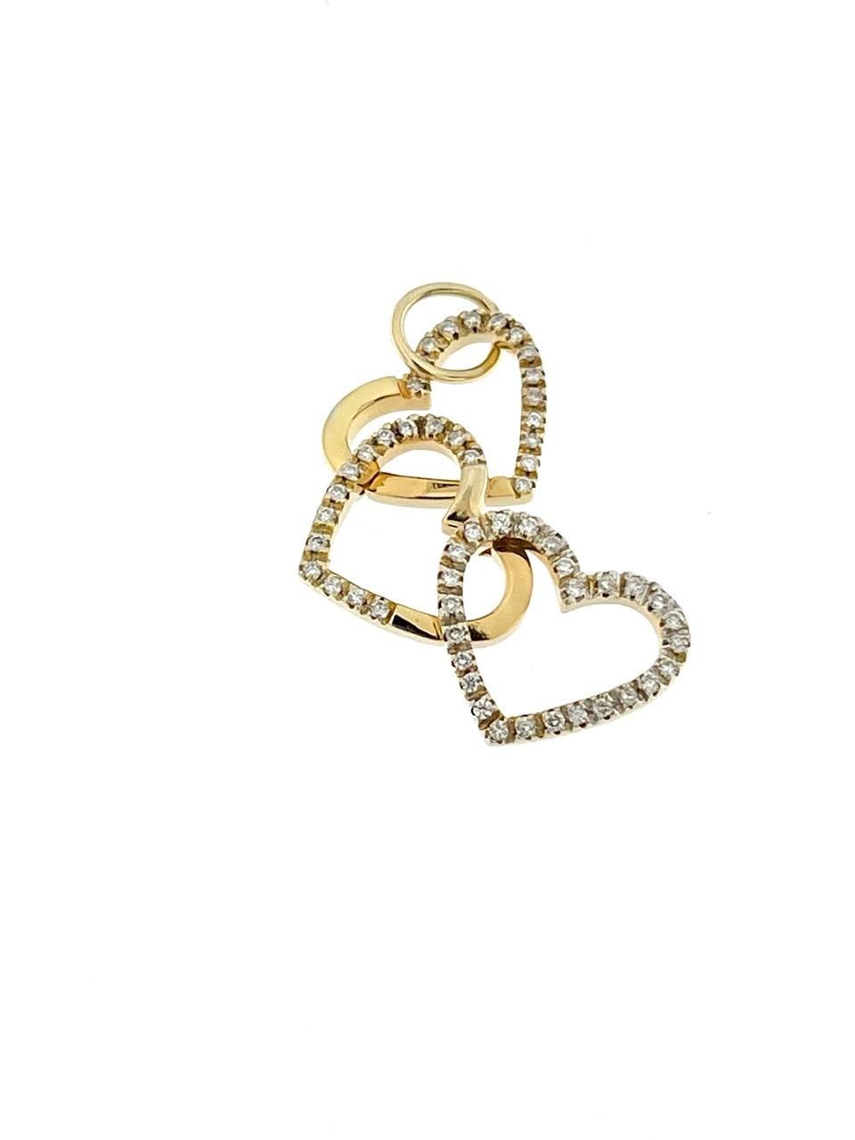The Italian Triple Heart Pendant in Yellow Gold with Diamonds is a captivating and intricately crafted piece of jewelry that exudes elegance and romance. This pendant showcases a design featuring three interlocking hearts, a classic symbol of love