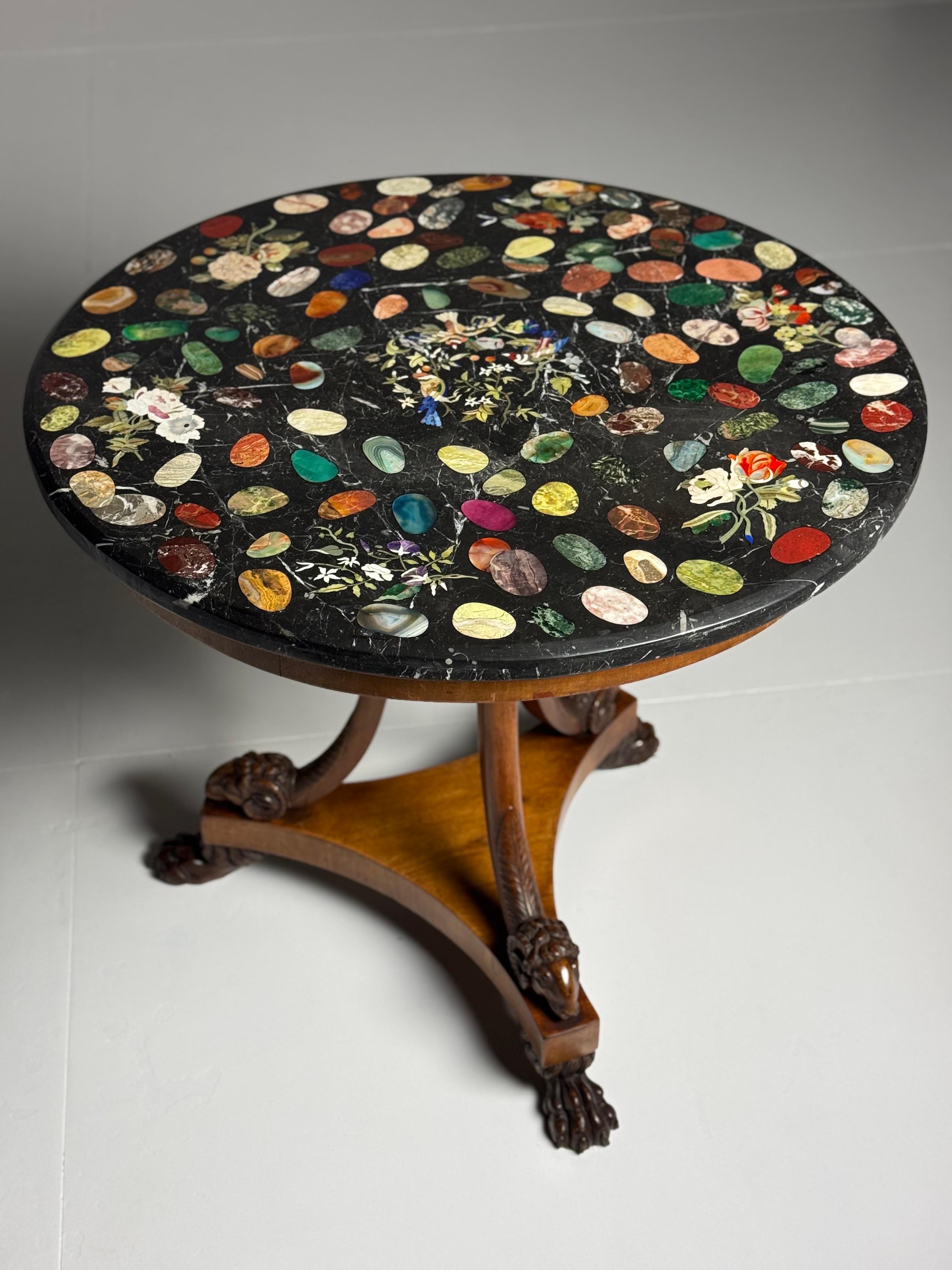 Unique Italian tripod centre table with marble inlaid top.

The base is an early 19th-century Italian tripod table (1820-1830). Made from mahogany with finely carved ram heads. Beautiful colour and patina.

The marble top with inlay dates from the