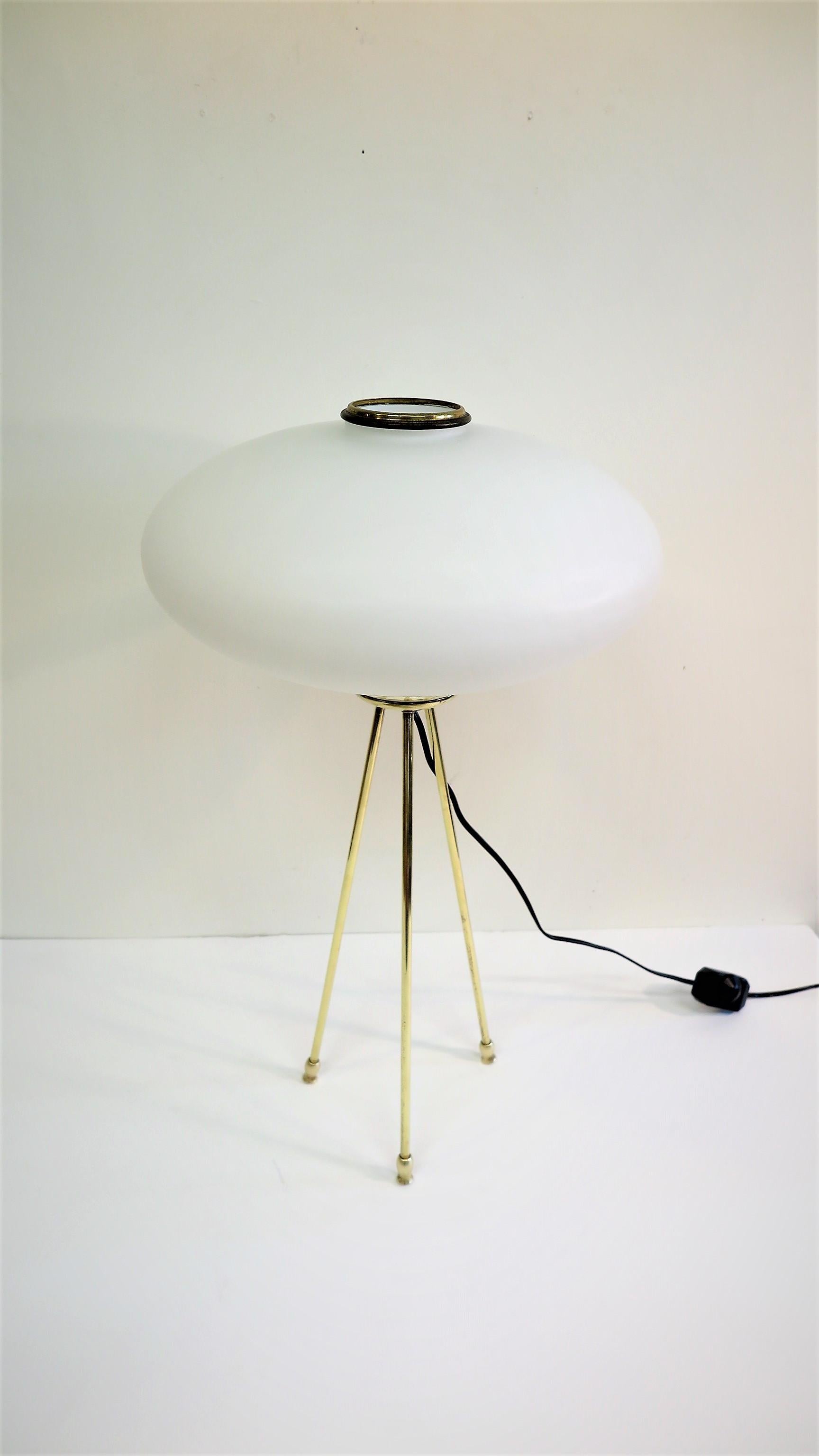Italian tripod opaline glass and brass lamp attributed to Stilnovo. Midcentury opaline glass and brass tripod lamp, Italy, 1950-1960. Can be used on table or floor. Excellent light spread or mood lighting can be adjusted with dimmer. In very good