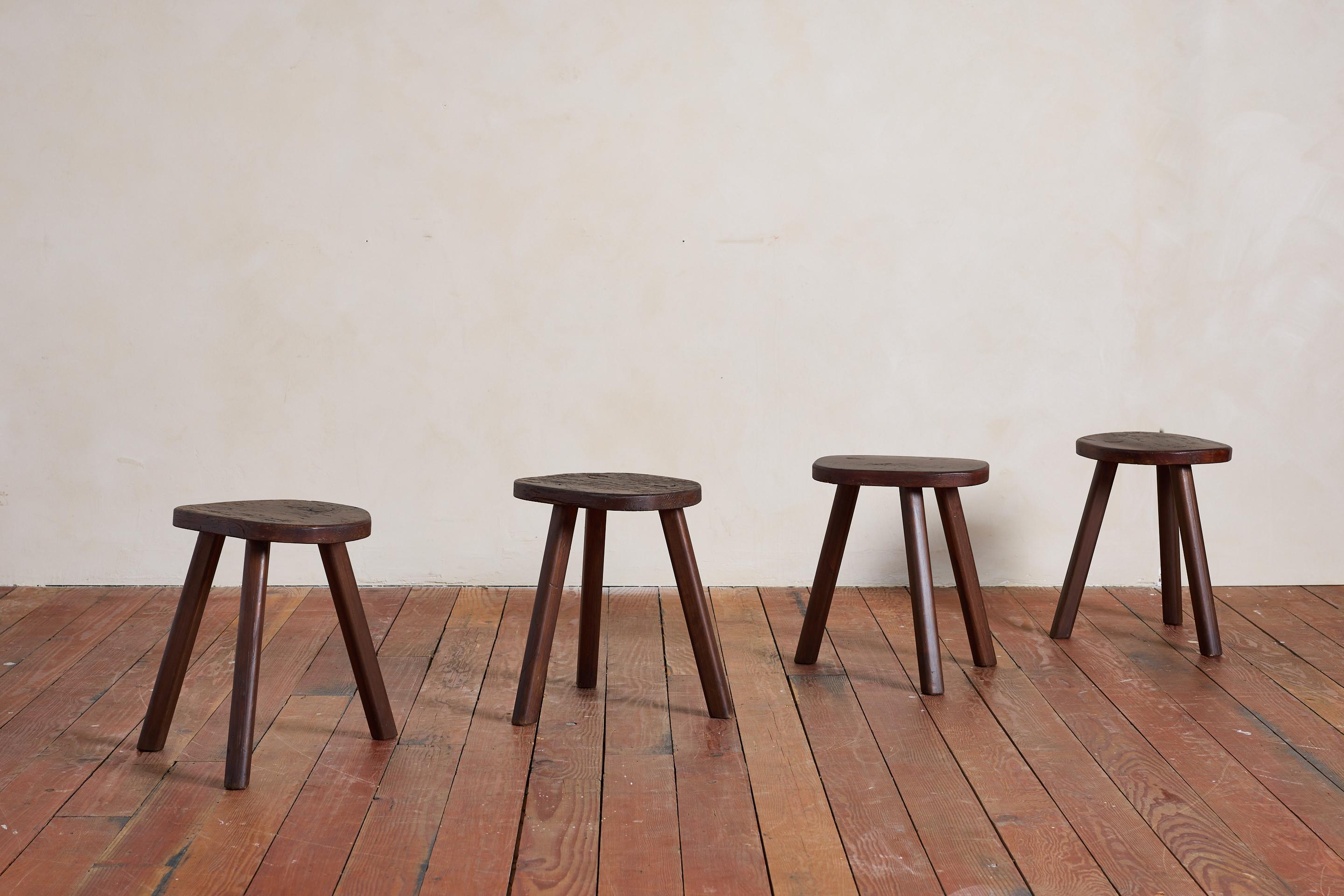 Solid wood carved tripod stools with tripod legs and wonderful worn patina.

Italy, 1950s 

Priced individually.