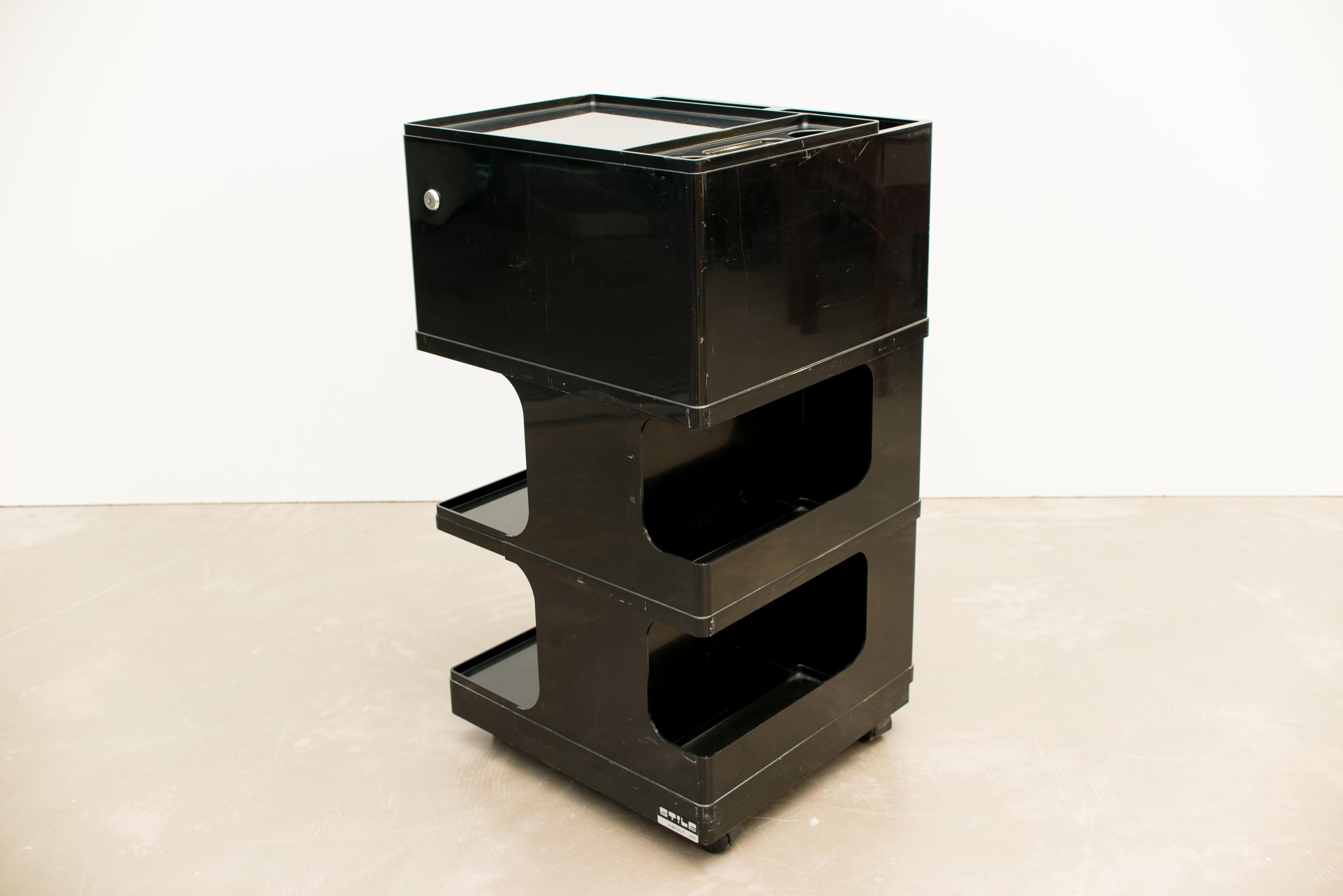 Vintage Italian work trolley was designed by Giovanni Pelis for Stile Neolt in Italy. It is made of black ABS plastic.