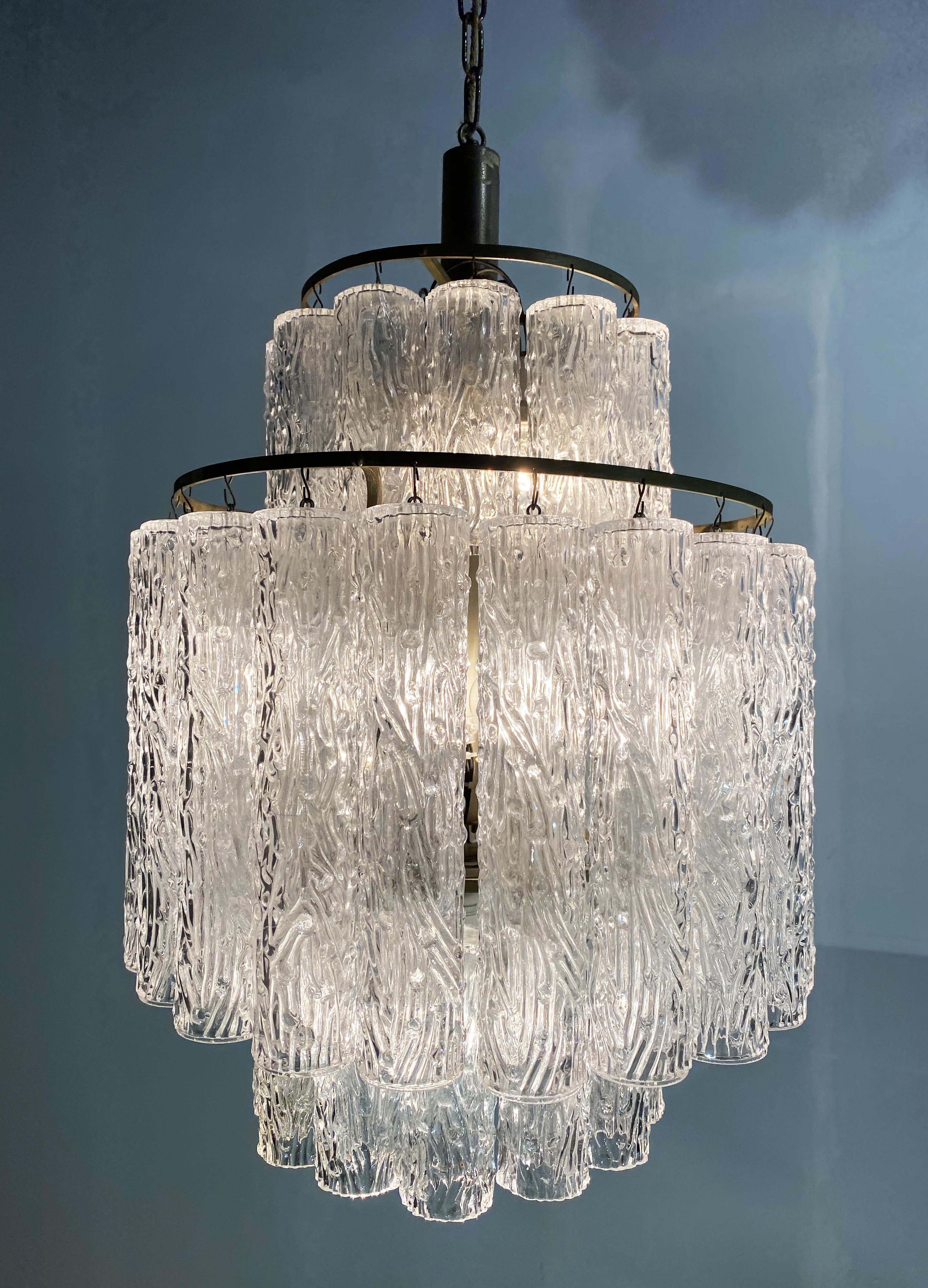 A very fine chandelier in the style Toni Zuccheri for Venini, each one composed by hand blown cylindrical glass pieces height each 30 cm.