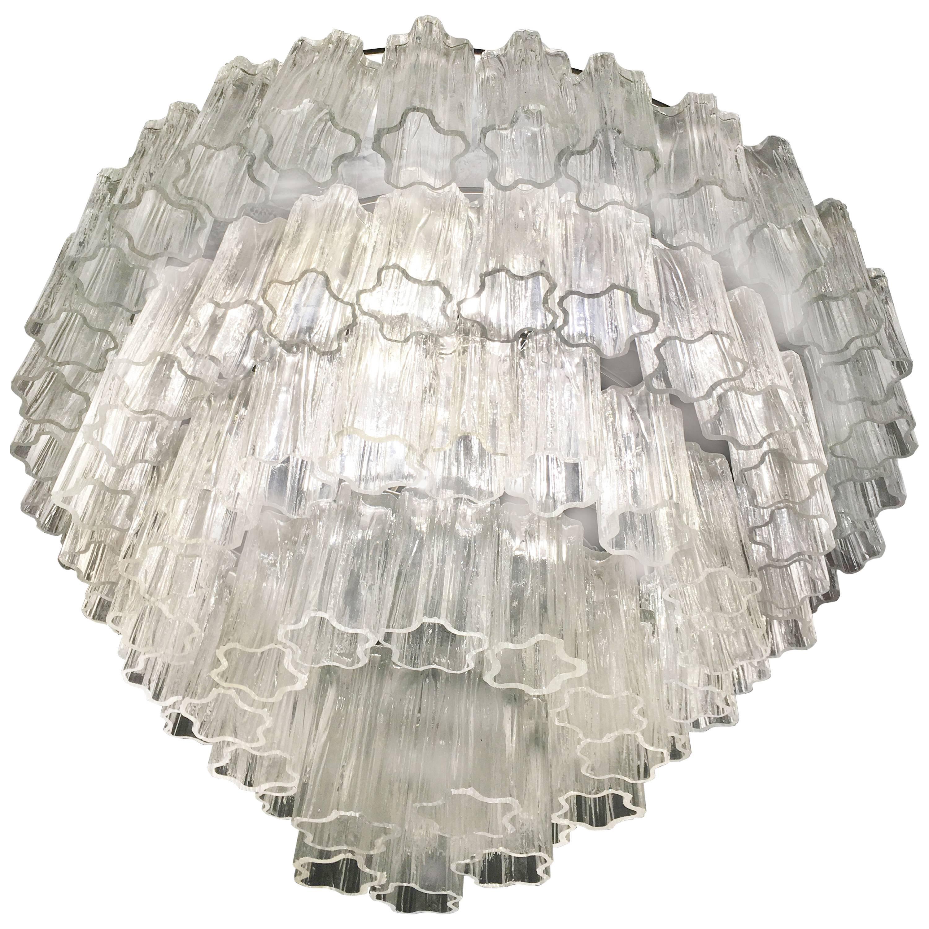 A very fine chandelier in the style Toni Zuccheri for Venini, each one composed by 100 truncated hand blown cylindrical glass pieces. Measure: Height each 25 cm.