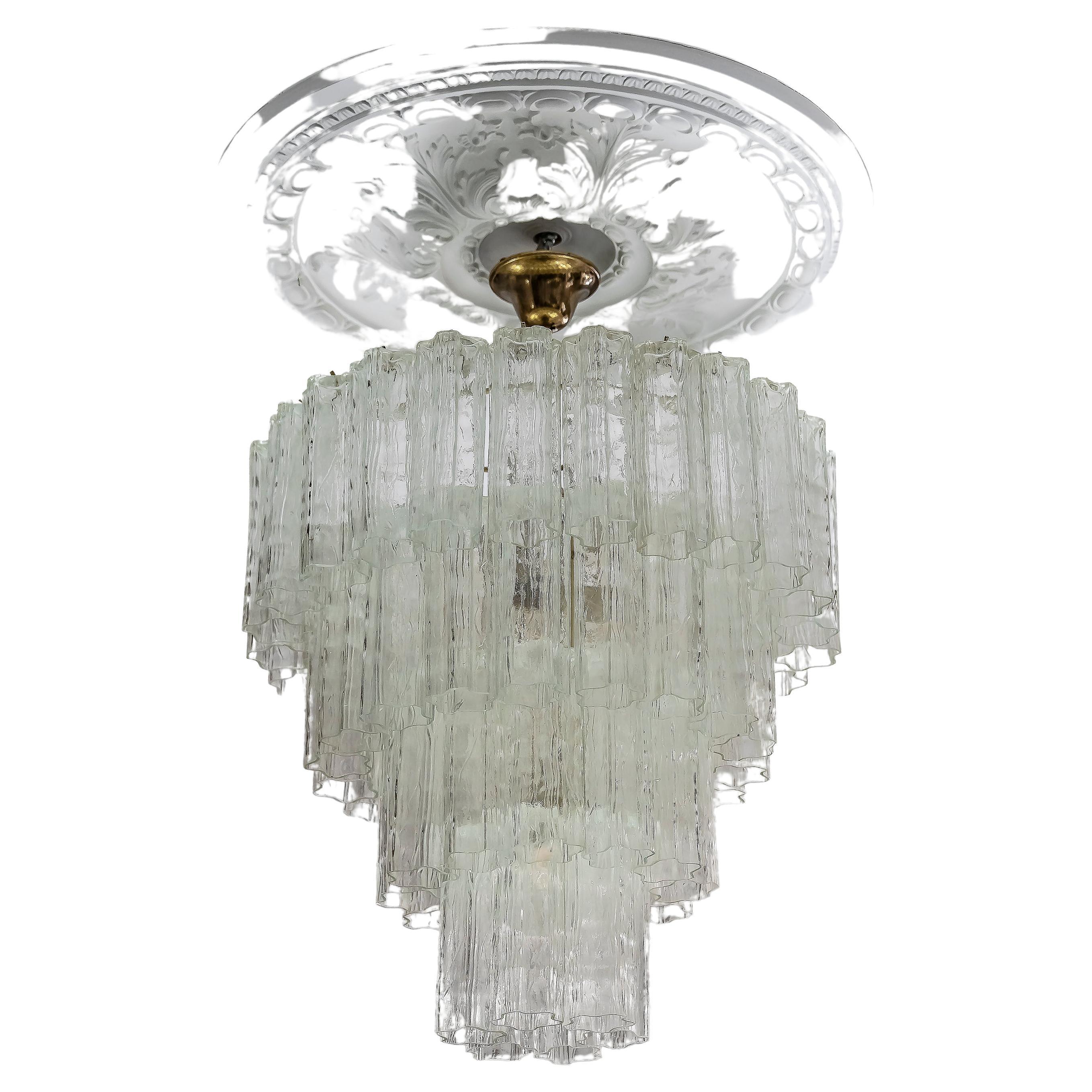 Italian handmade Murano glass chandelier.
The design of this chandelier is made metal base with opaline color Tubi Tronchi glass elements. 
Its is in a very good original vintage condition.
Bulbs 7 pcs. E27.



