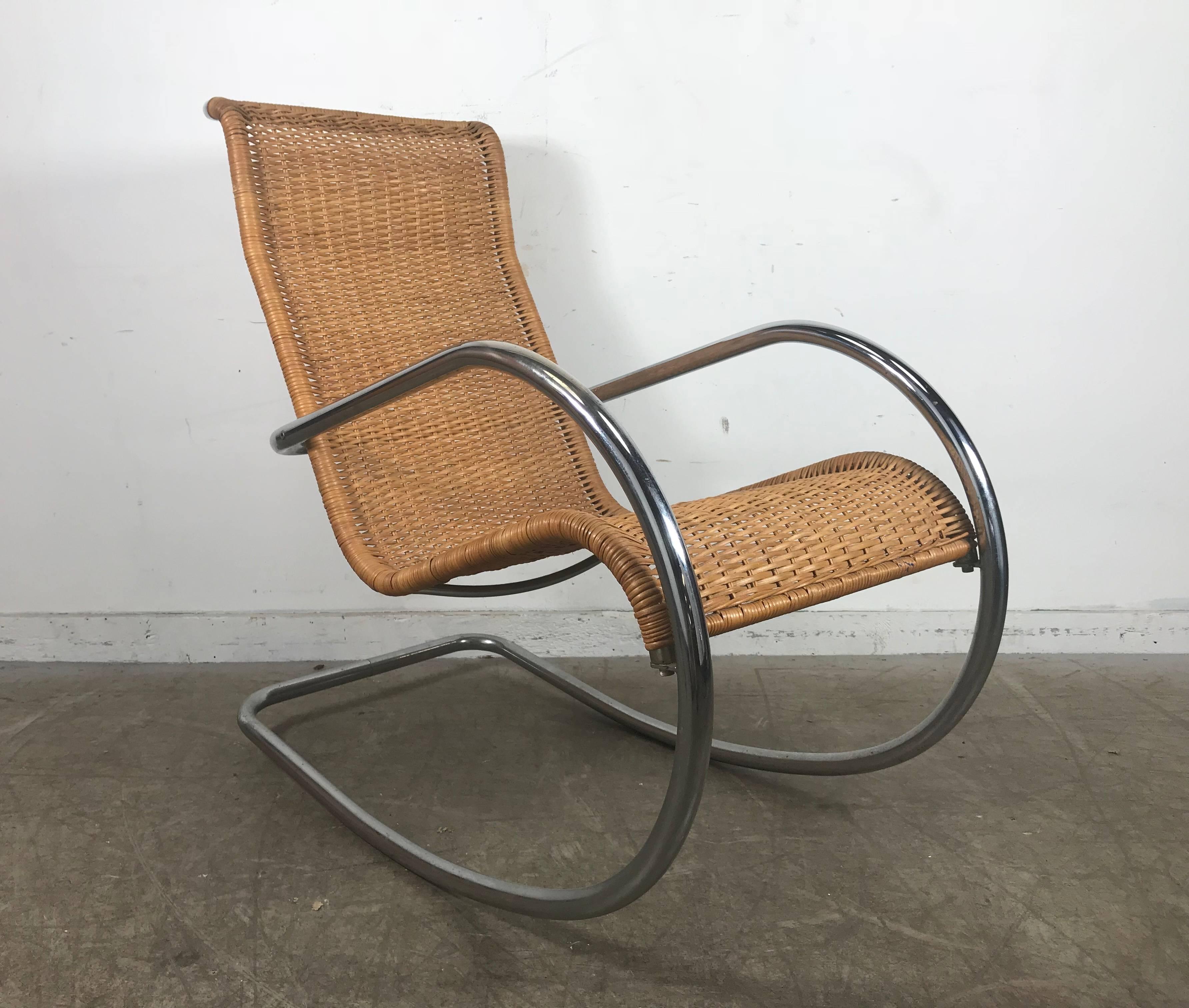 Well constructed tubular chrome and wicker vintage rocker, marked made in Italy, extremely comfortable.
Clearly a take on Mies van der Rohe's cantilevered chair designs.