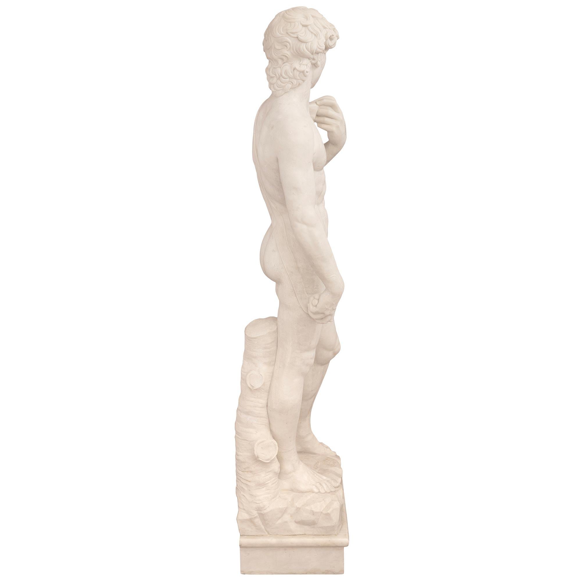 20th Century Italian turn of the century white Carrara marble statue of Michelangelo's David. For Sale