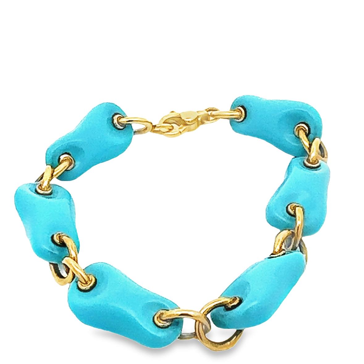 This bold Italian natural turquoise bracelet delivers a modern attitude. Offered by Alex & Co, 6 tumbled pieces of rare, natural, untreated turquoise. These special high-quality gemstones are connected by 18 karat solid yellow gold rounded links.