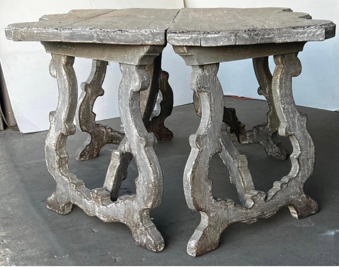 Beautiful pair of Italian Tuscan Demilune consoles talentedly hand crafted out of 18th century wood by European master artisans in the 21st Century. These stunning tables are constructed with a serpentine top and harp shaped split pedestal legs.