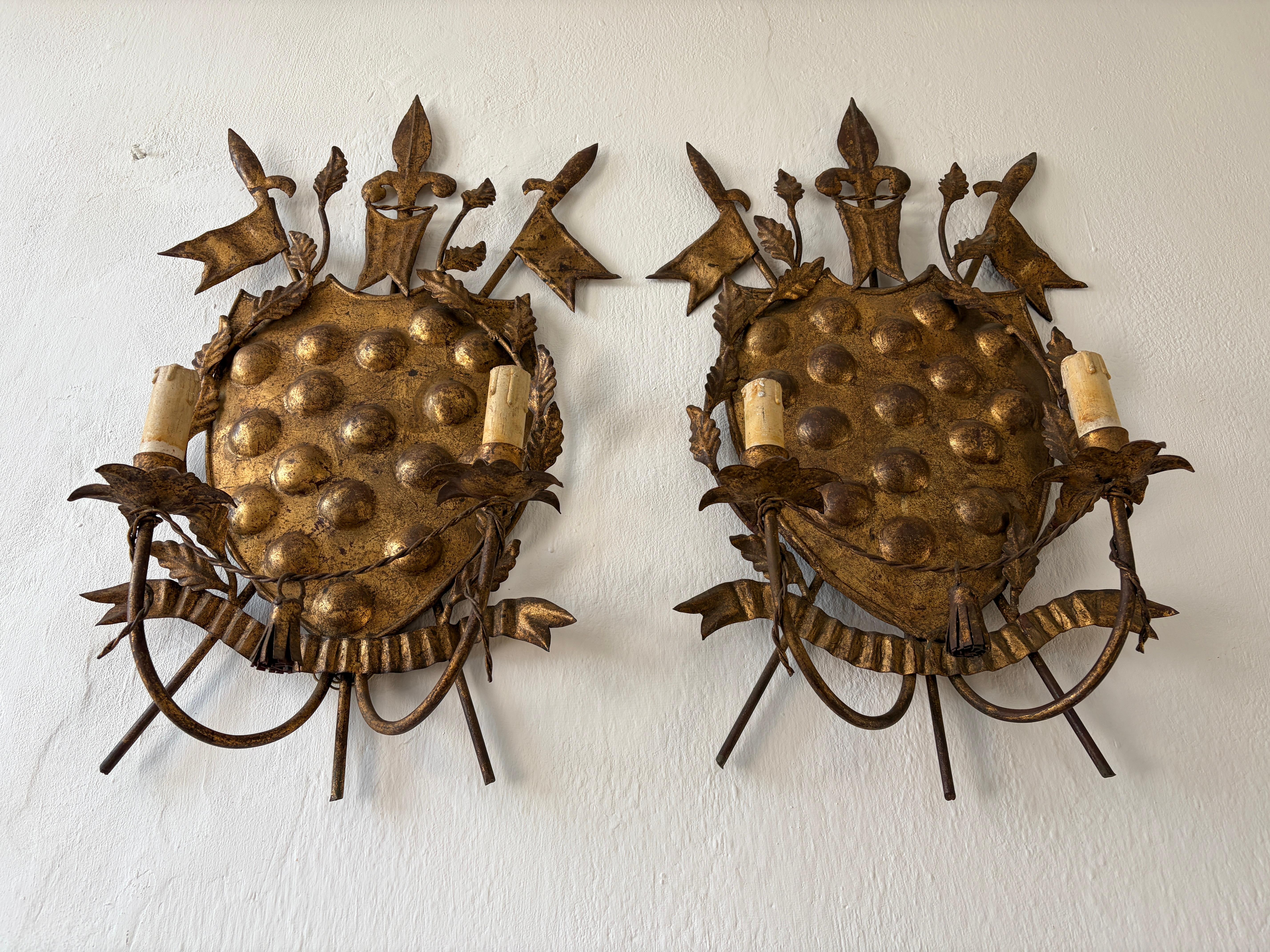Housing 2 lights each. These will be rewired with certified UL US sockets for the USA and appropriate sockets for every other country. and ready to hang. These Medici coat of arms sconces were found in Tuscany.  Their coat of arms started off with