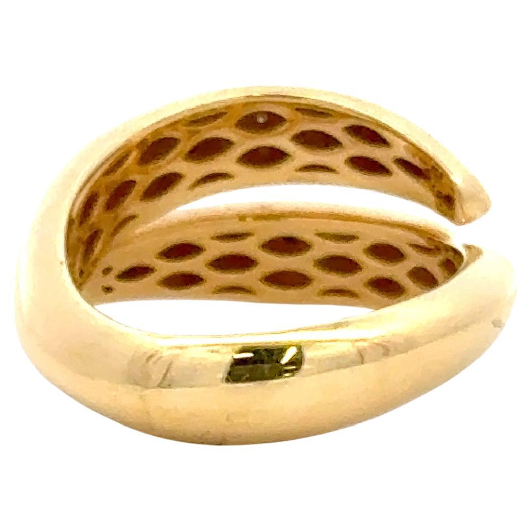 Elegantly crafted in Italy from polished 18 karat yellow gold, this refined ring features a sleek, rounded silhouette highlighted by two rows of sparkling diamonds. Set with 24 round brilliant-cut diamonds totaling 0.29 carats, the stones display a
