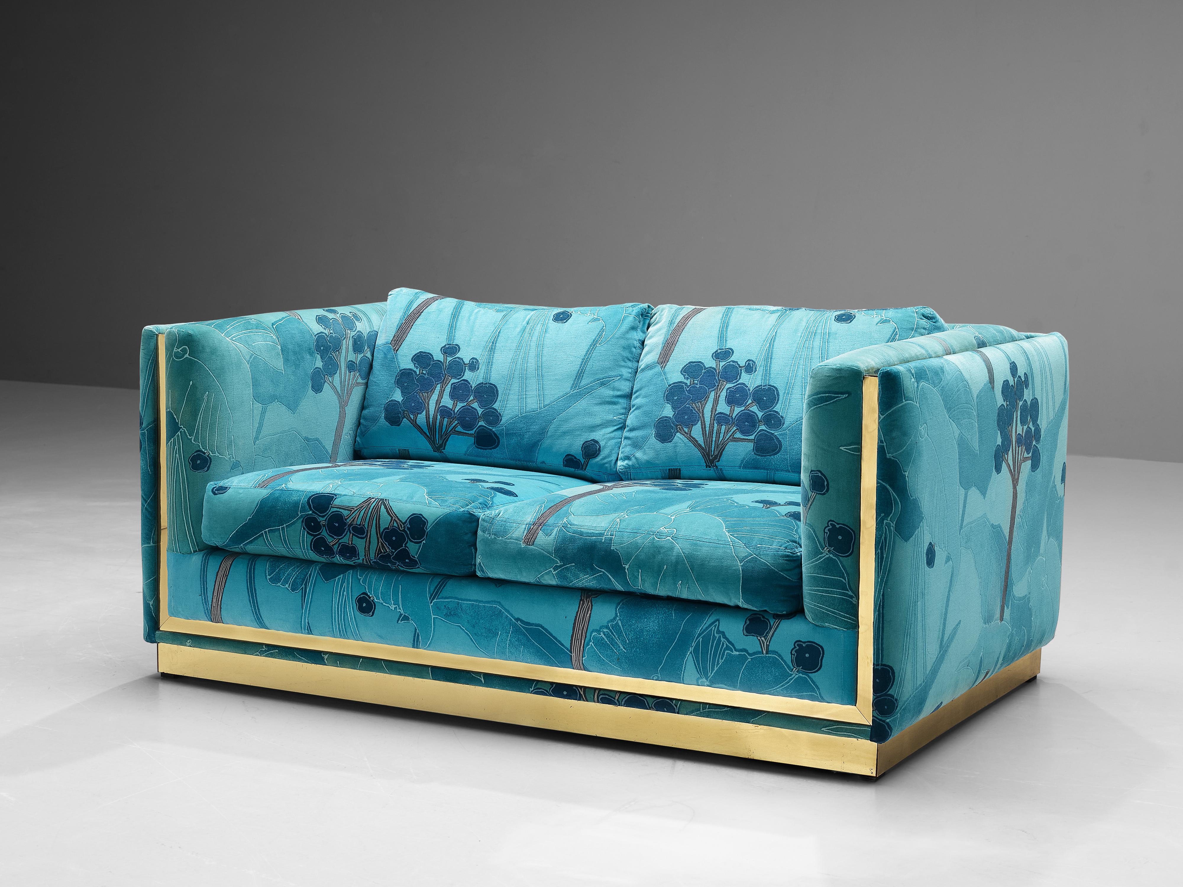 Sofa, fabric and brass, Italy, 1970s 

The upholstery of this gorgeous sofa features illustrative pattern of fauna and flora. The fabric is executed in vibrant colors in different shades of blue and turquoise. This piece of furniture is designed