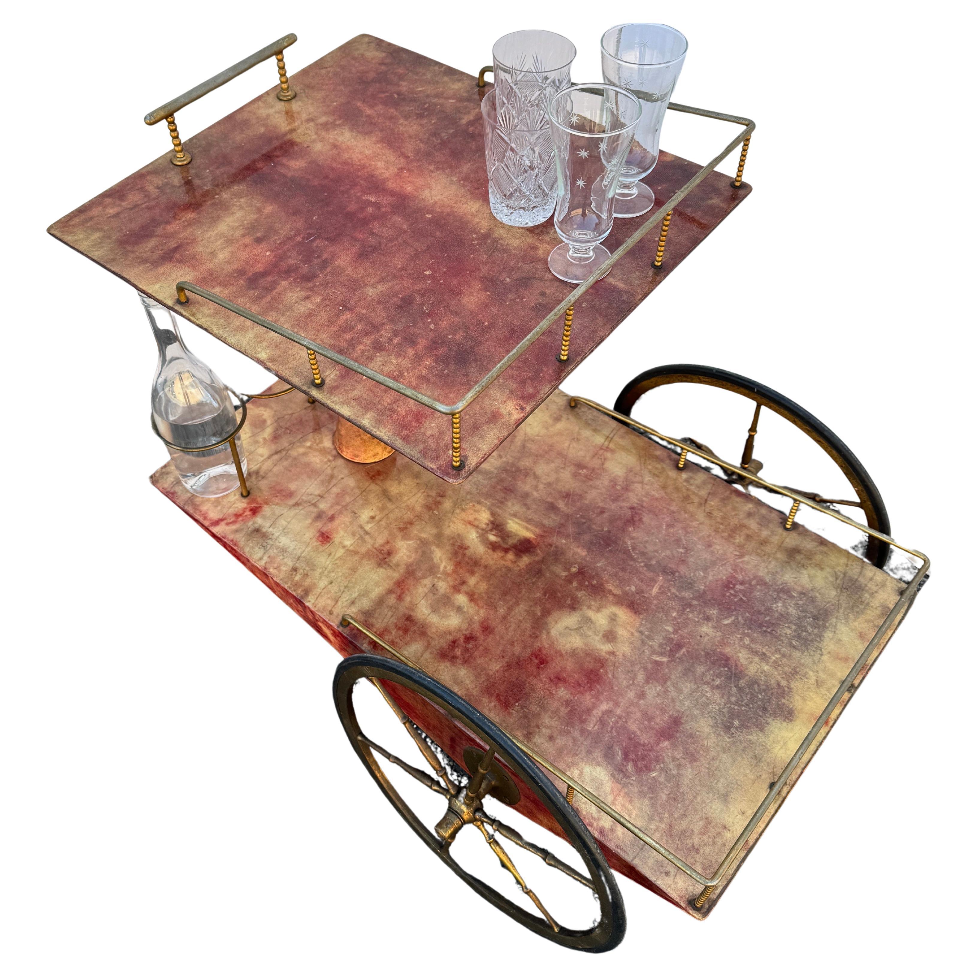Mid-Century Modern Geometric Designed Bar Trolley, Italy 1960's.

An original vintage Aldo Tura trolley in dark brown lacquered goatskin and brass plated metal. Very geometric design that has the classic Aldo Tura Mid-Century charm and certainly a