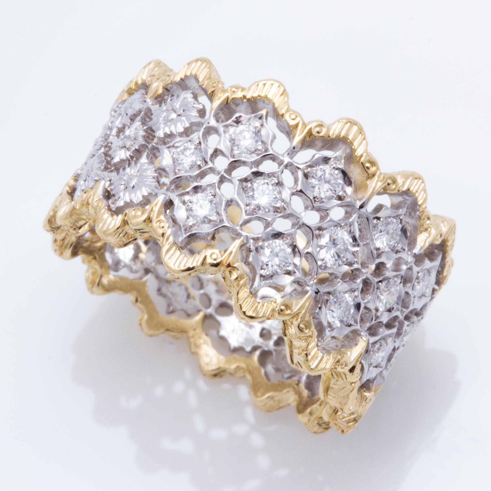 Hand crafted in Florence, this ring is entirely hand engraved and features a  gracefully scalloped edge and has a total diamond weight of .34ct.  

Offered by noted jewelry designer David Meelheim Designs, David creates unique pieces incorporating