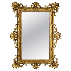 Miroir mural italien de style Ombertine en bois doré, années 1930