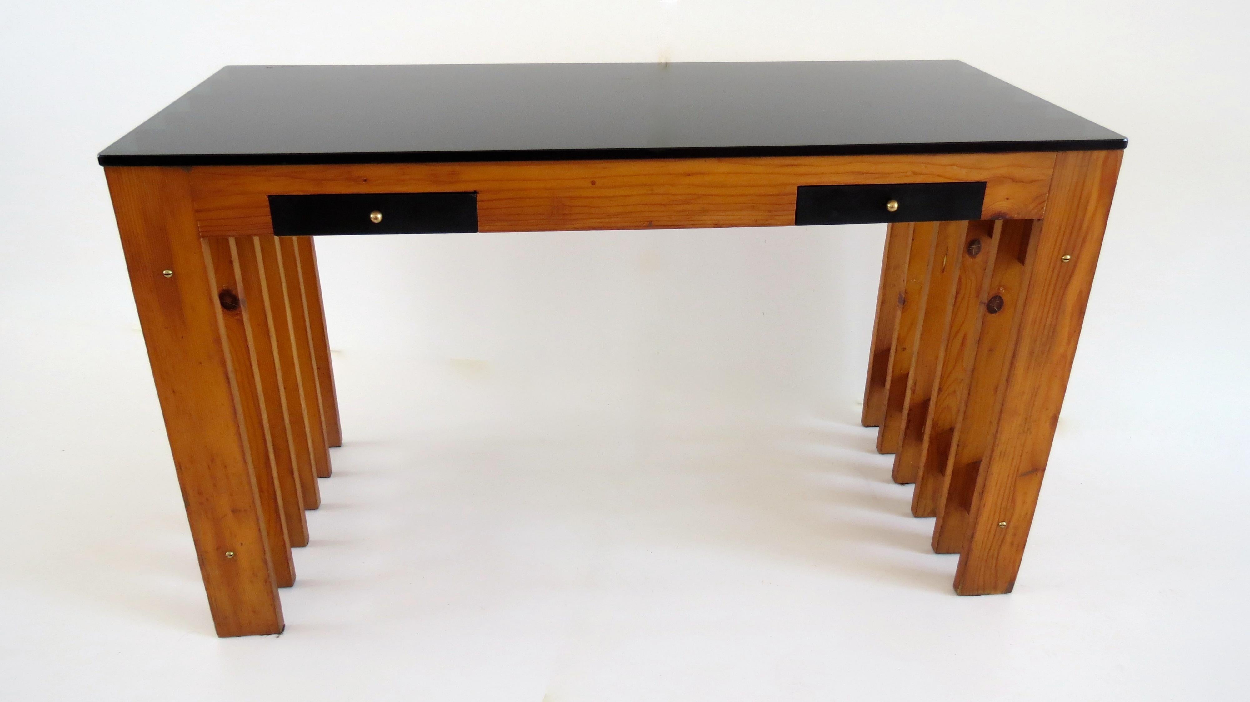 Interesting and original pine and opaline desk console, circa 1960
unique piece prototype for a private residence in Forte dei Marmi
two black lacquered drawers, screws brass
pine tree, black opaline glass, brass
six pine frame assembled as a