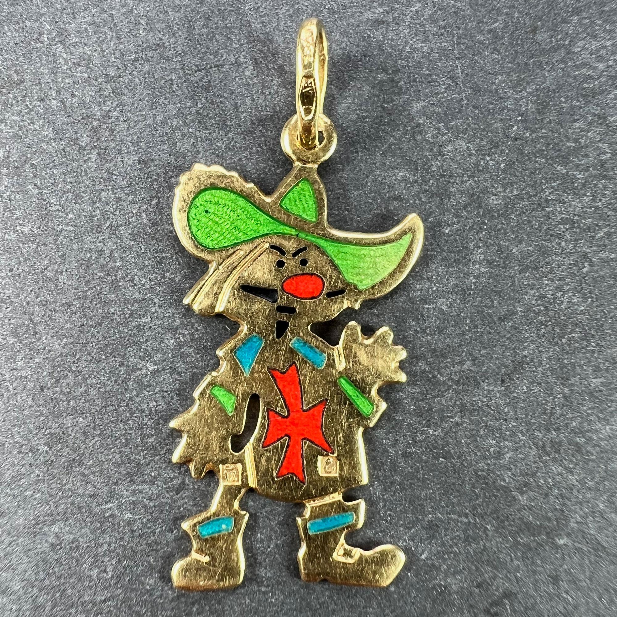 An Italian 18 karat (18K) yellow gold charm pendant designed as a cartoon muskateer with red, blue, green and black enamel detail.

Stamped 750 for 18 karat gold, 1AR for Italian manufacture and UnoAErre, along with their maker's mark.

Dimensions: