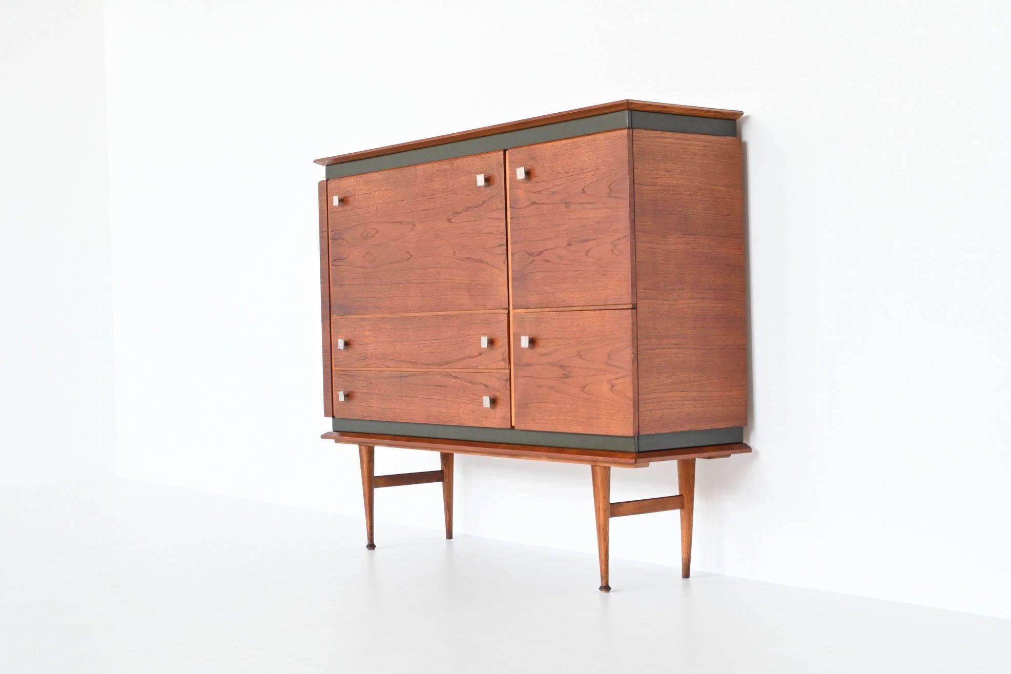 Beautiful shaped Italian buffet cabinet by unknown designer or manufacturer, Italy 1960. This amazing buffet has a nice teak grain and is in fully original condition. It is made of veneered teak wood with green faux leather and metal details. The