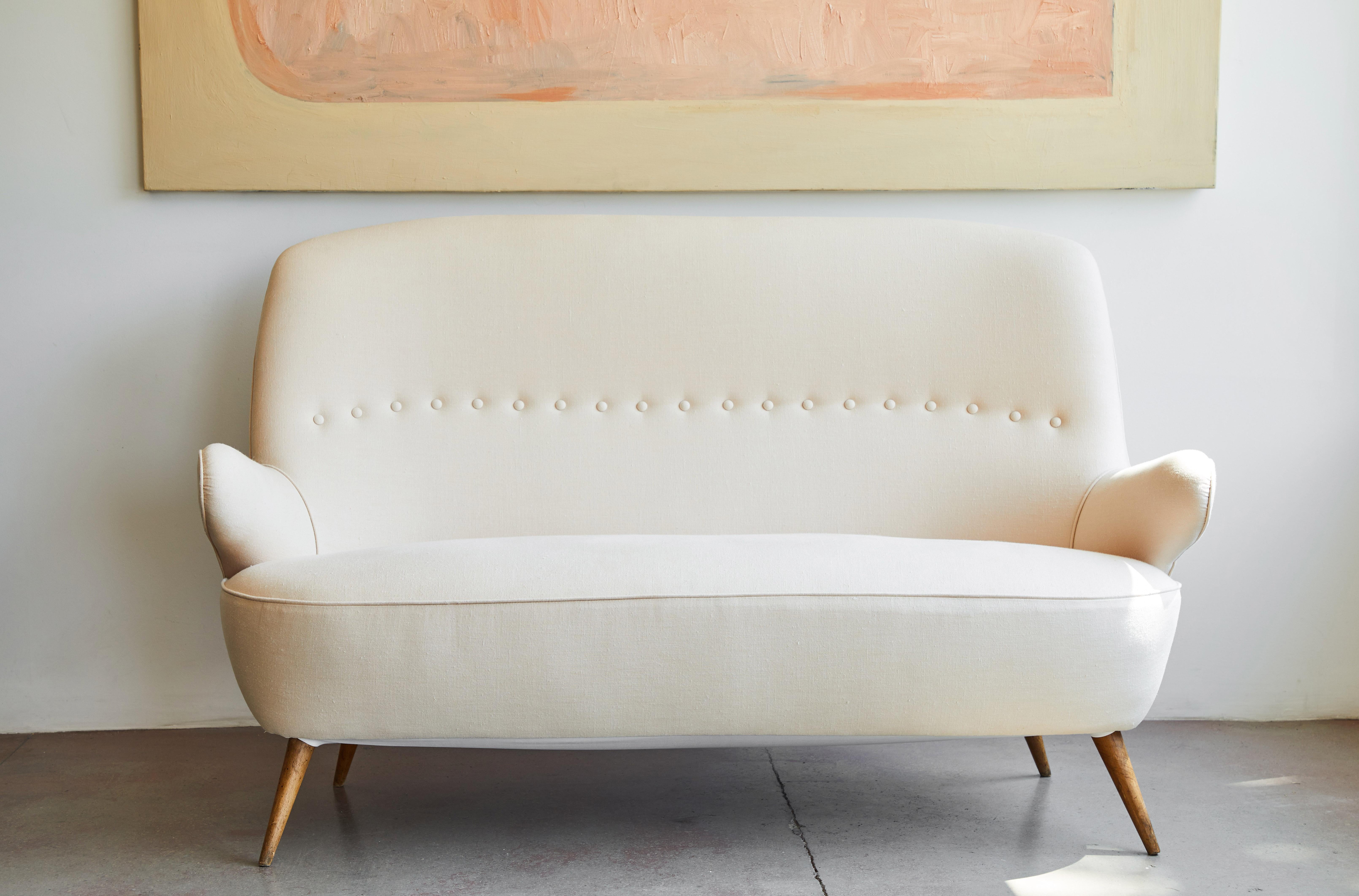 Italian loveseat newly upholstered in Belgian linen, made in Italy, circa 1950s.

           