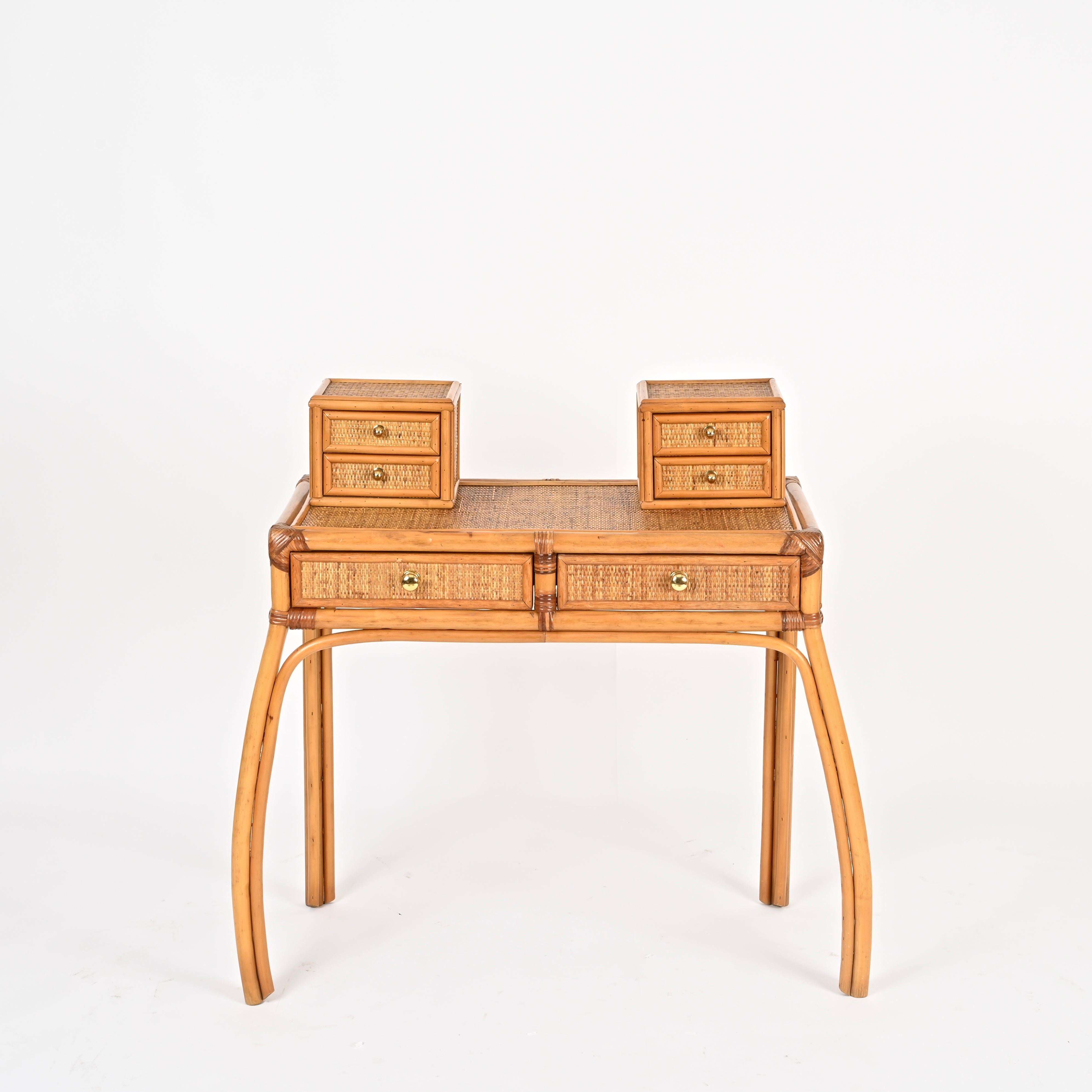 Wonderful Mid-Century vanity or console table fully made in bamboo, rattan, hand-woven wicker, and brass. This stylish and unique piece was designed by Vivai del Sud and produced in Italy during the 1970s.

In fabulous condition and featuring a