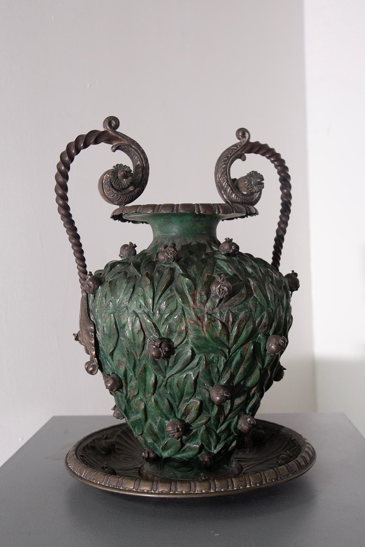 Vase with copper base and partial silver plating

Italy, probably Rome or Naples, late 19th century
Elegant ornamental vase in embossed and silver-plated copper, with an antique green patina of extraordinary chromatic depth. The ovoid body is
