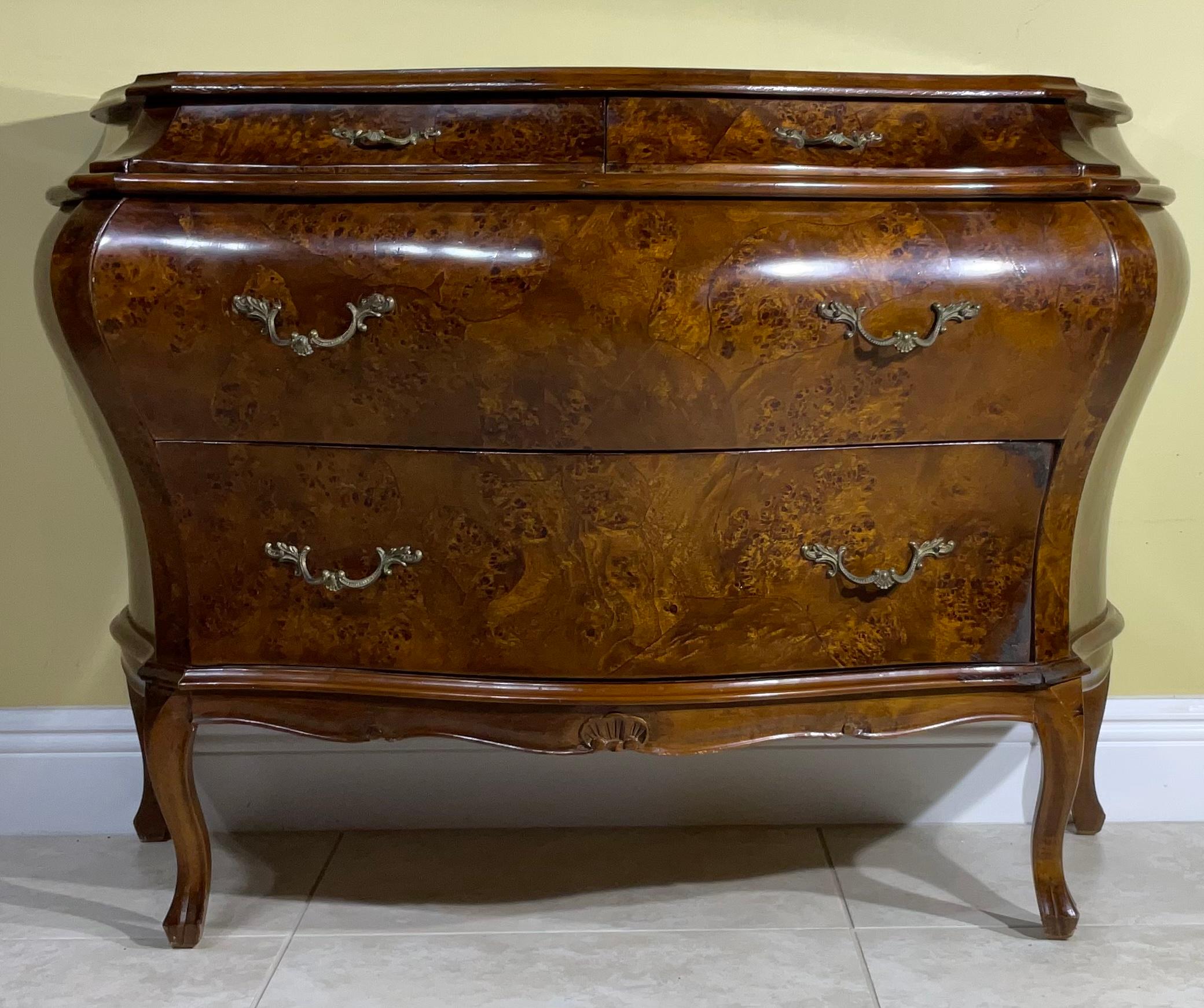 Beautiful 1970 chest and drawers hand crafted and carved from wood, probably Olive wood Venere top and three sides. The chest Has two large drawers and two small one at the top, the drawers covered with the original decorative paper, brass hardware.