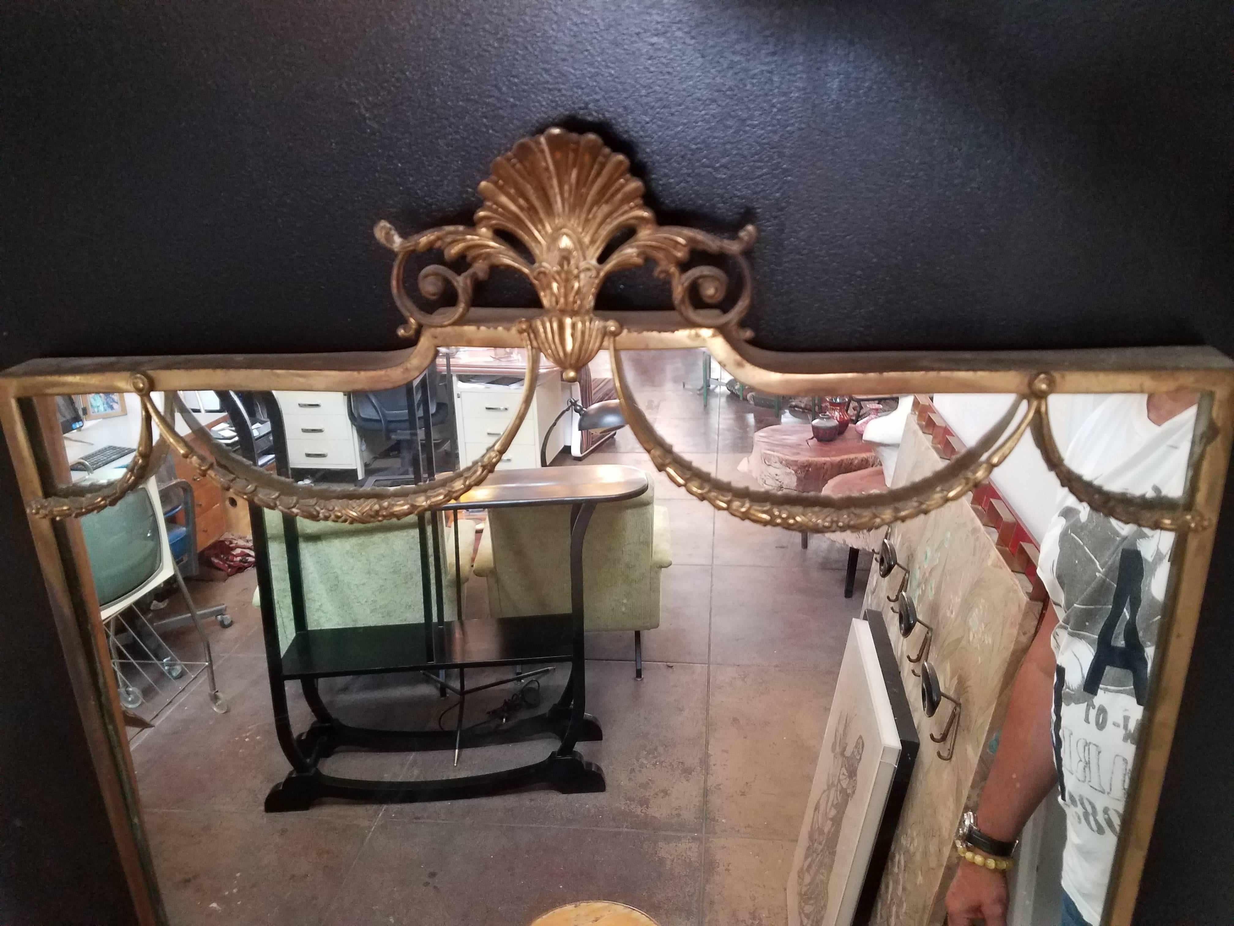 
1950s Venetian brass mirror. Base is walnut all together gorges patina.
