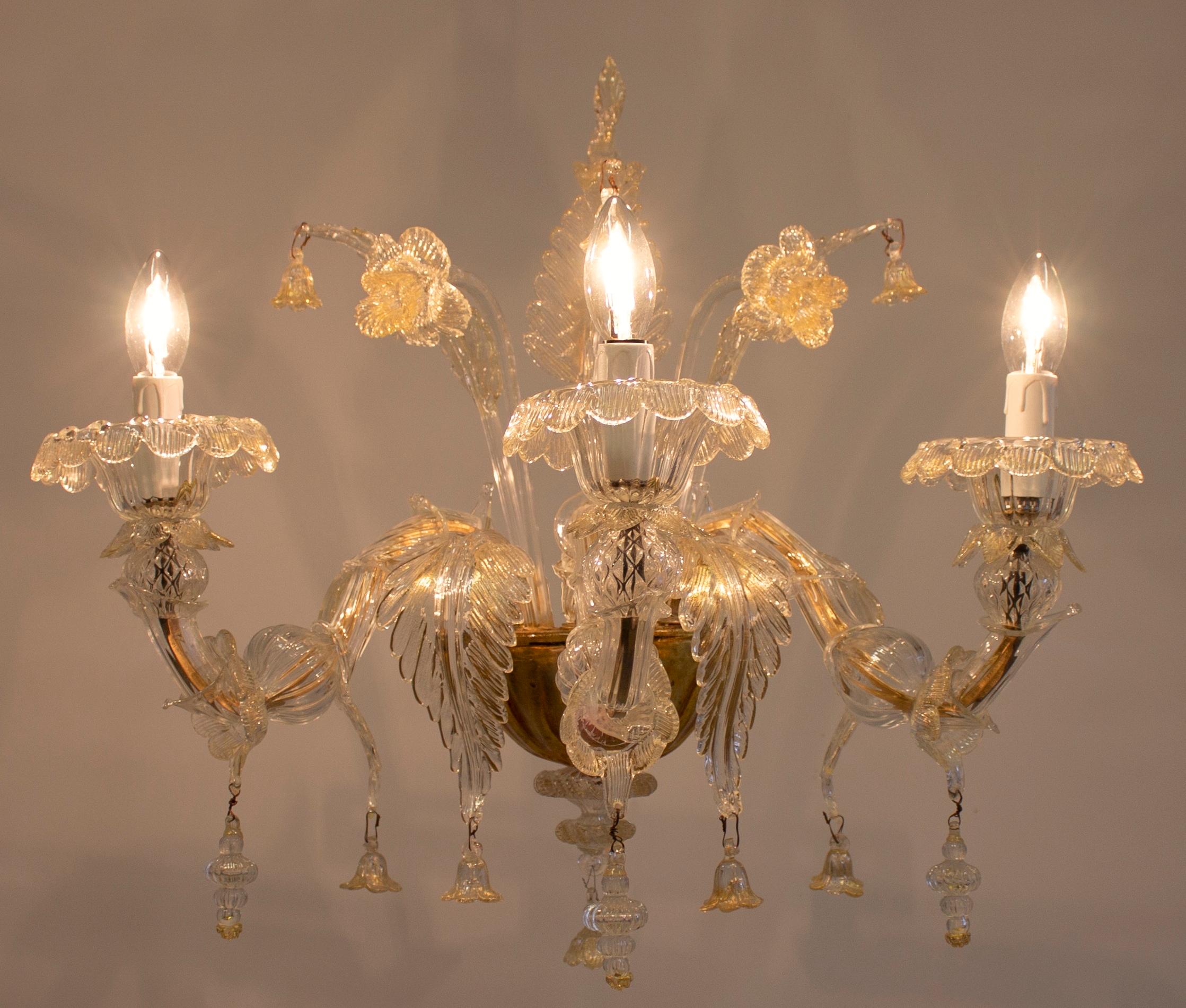 Elegant Italian Venetian Ca' Rezzonico set of sconces, blown Murano glass, 24-karat gold color. This is a set of four sconces, entirely handcrafted and manufactured in the Island of Murano, in Venice, where the art of the blown Murano glass is an