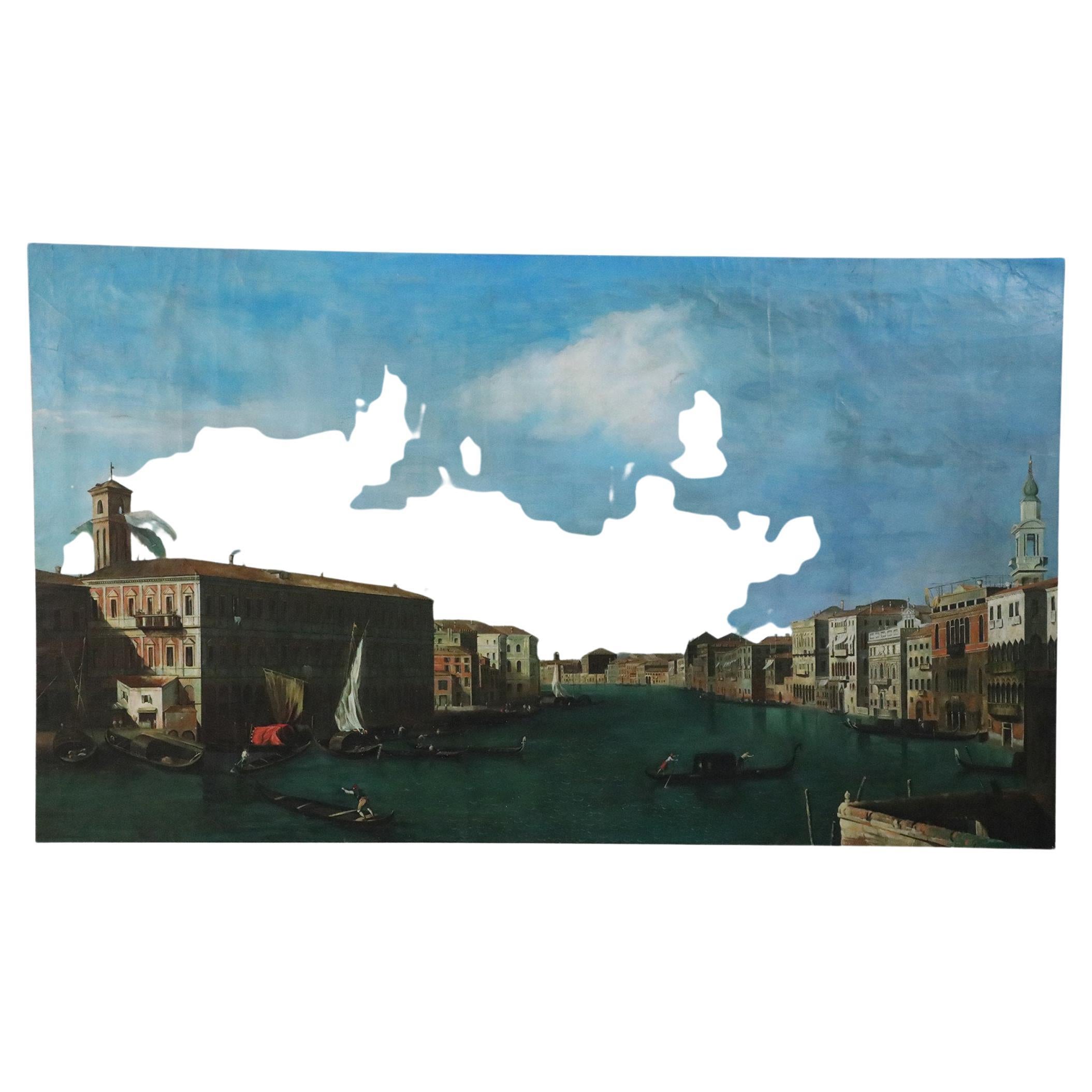 Vintage Venetian-style (20th Century) painting of a canal busy with gondolas winding through a town of classical architecture cast partly in shadow, under a blue sky. Painted on rectangular, unframed canvas.
 