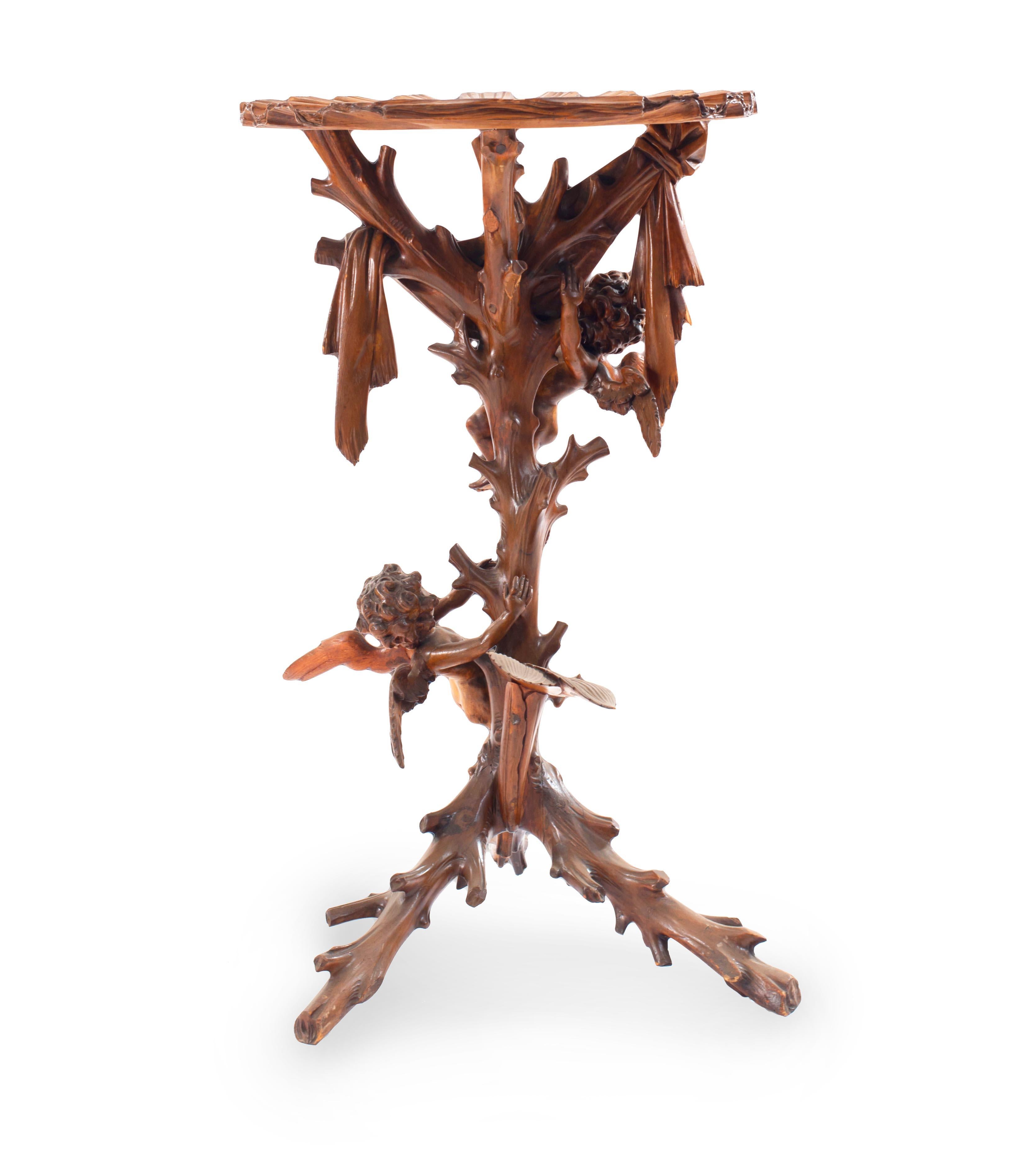 Italian Venetian (19th Century) carved fruitwood pedestal with shell top and cupids climbing tree.
