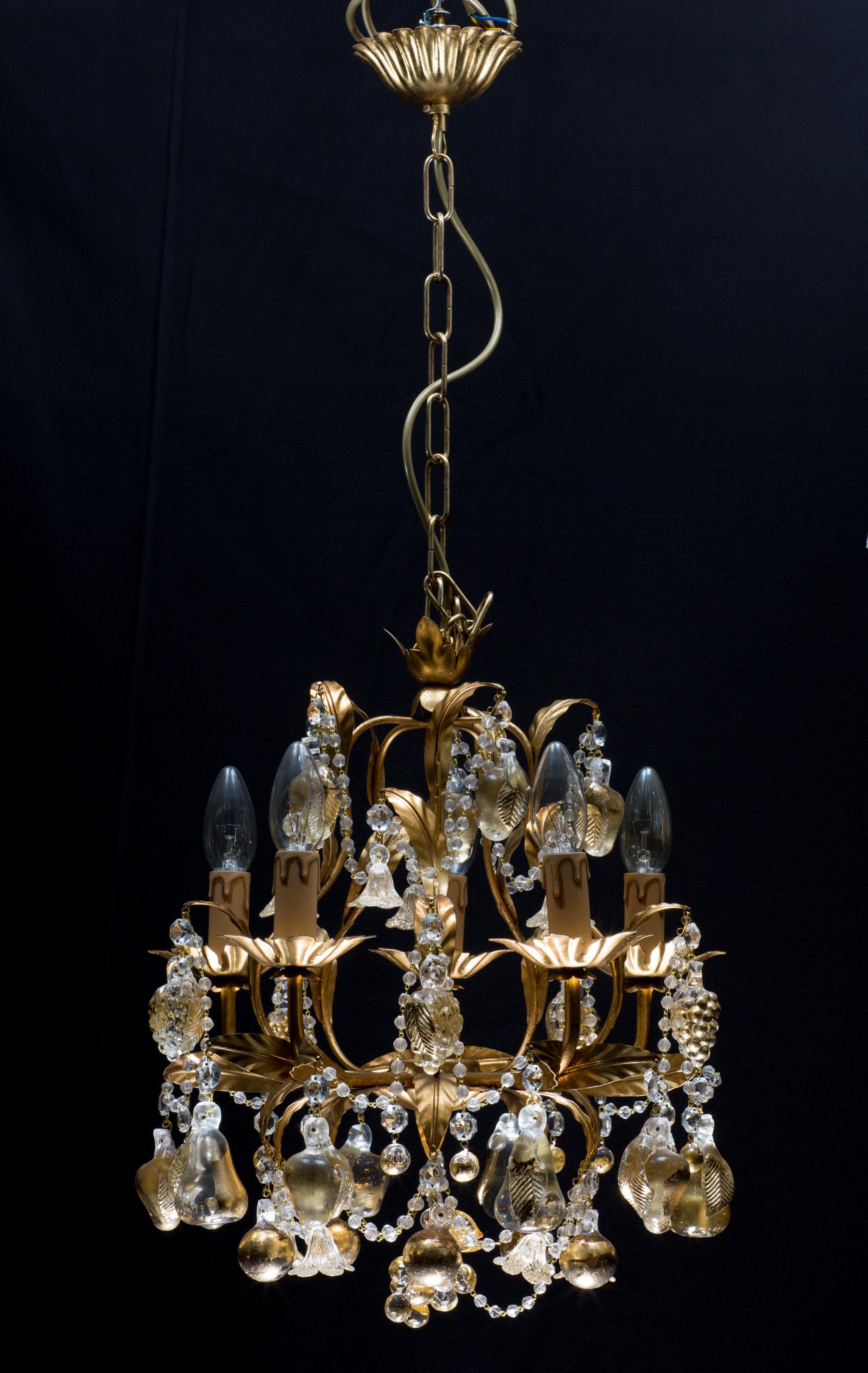 21st century Italian Venetian chandelier with 24-karat gold embedded Murano glass. Handcrafted in Venetia.
The whole chandelier is embedded with 24-karat gold. This exquisite piece is ornamented with golden leaves   
and dangling handmade glass