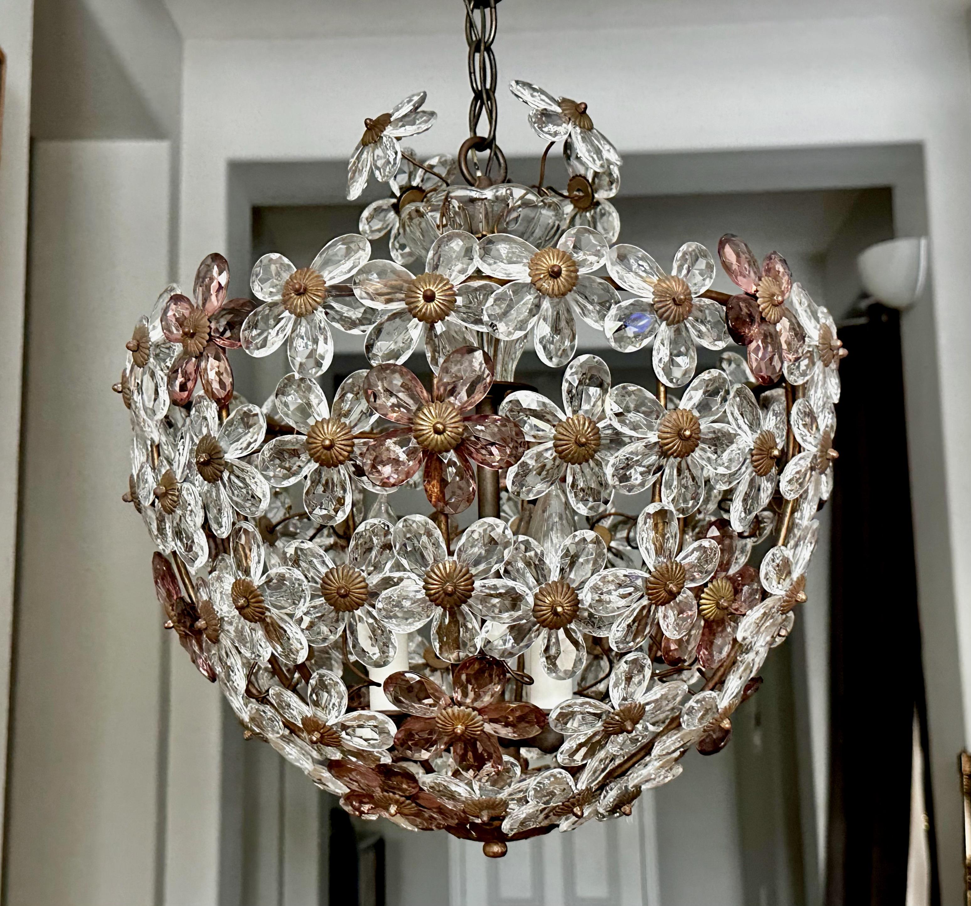 Elegant Bagues style crystal floral or flower pendant or chandelier light with brass bronzed patina frame hardware and ceiling cap.  The 5 petal cut crystal pedal flowers alternate in clear and amethyst purple. Fixture uses 3 candelabra base bulbs