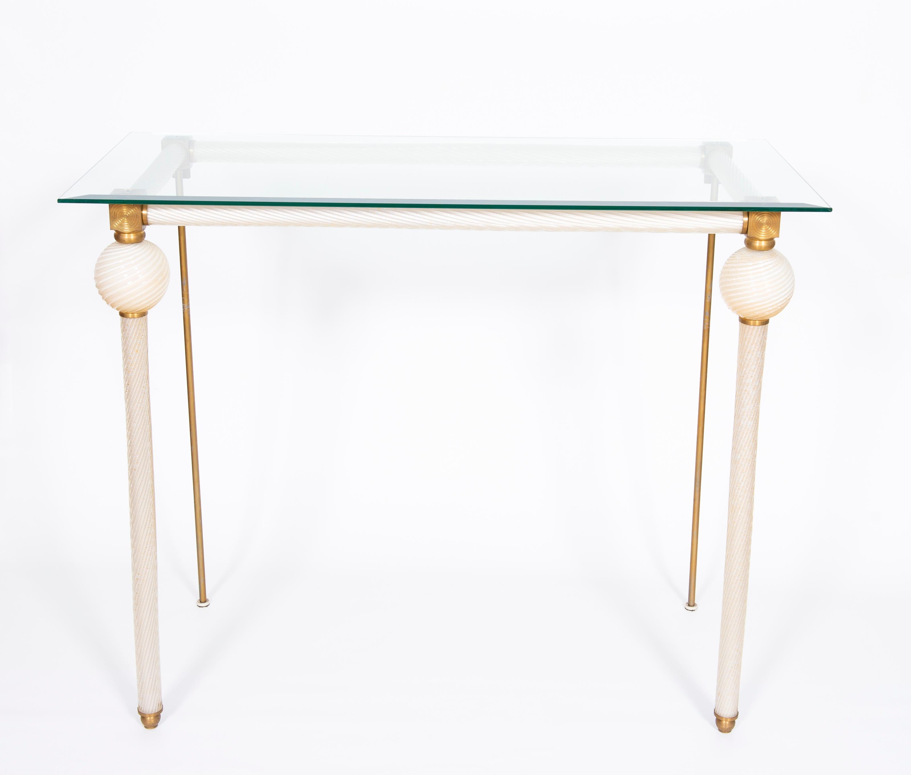 Console Table Milk color Murano Glass and Gold Touches 1980s Giovanni Dalla Fina.
This captivating Console Table is an exquisite example of Venetian craftsmanship, entirely handcrafted in blown Murano glass and handcrafted brass.
The Console Table