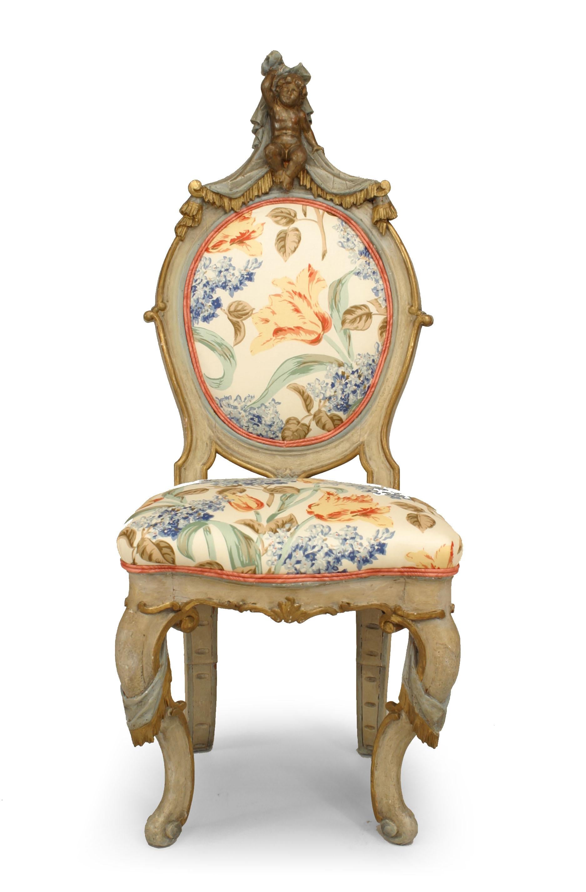 Pair of 19th century Italian Venetian style white and blue painted and gilt trimmed side chairs with drape and cupid carved backs.