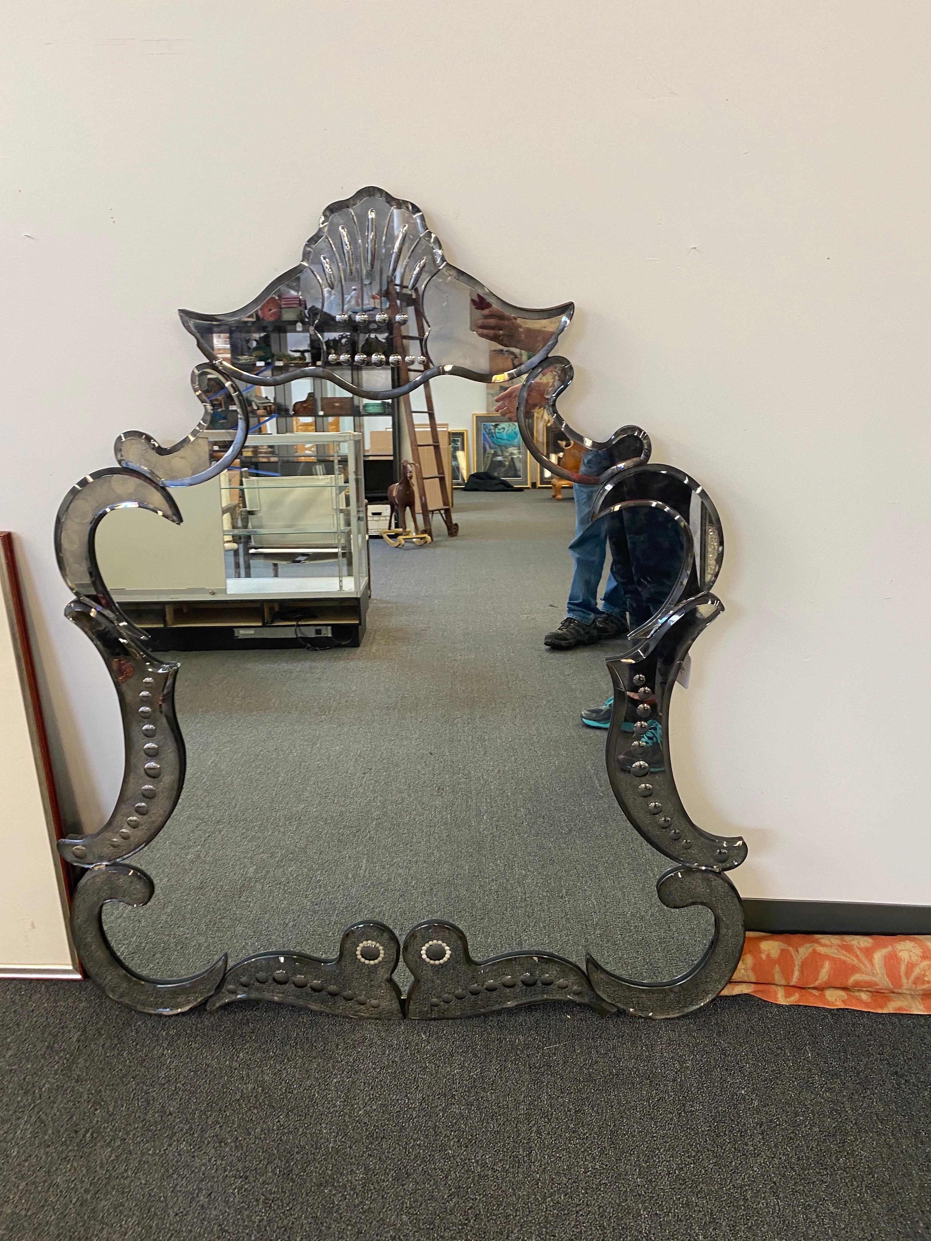 Large Vintage Venetian Etched Glass Mirror from early to mid 20th c. Minor chips to glass on side, hardly visible when hanging due to mottled natural of antique mirror glass and etched glass details.

Dimensions
52