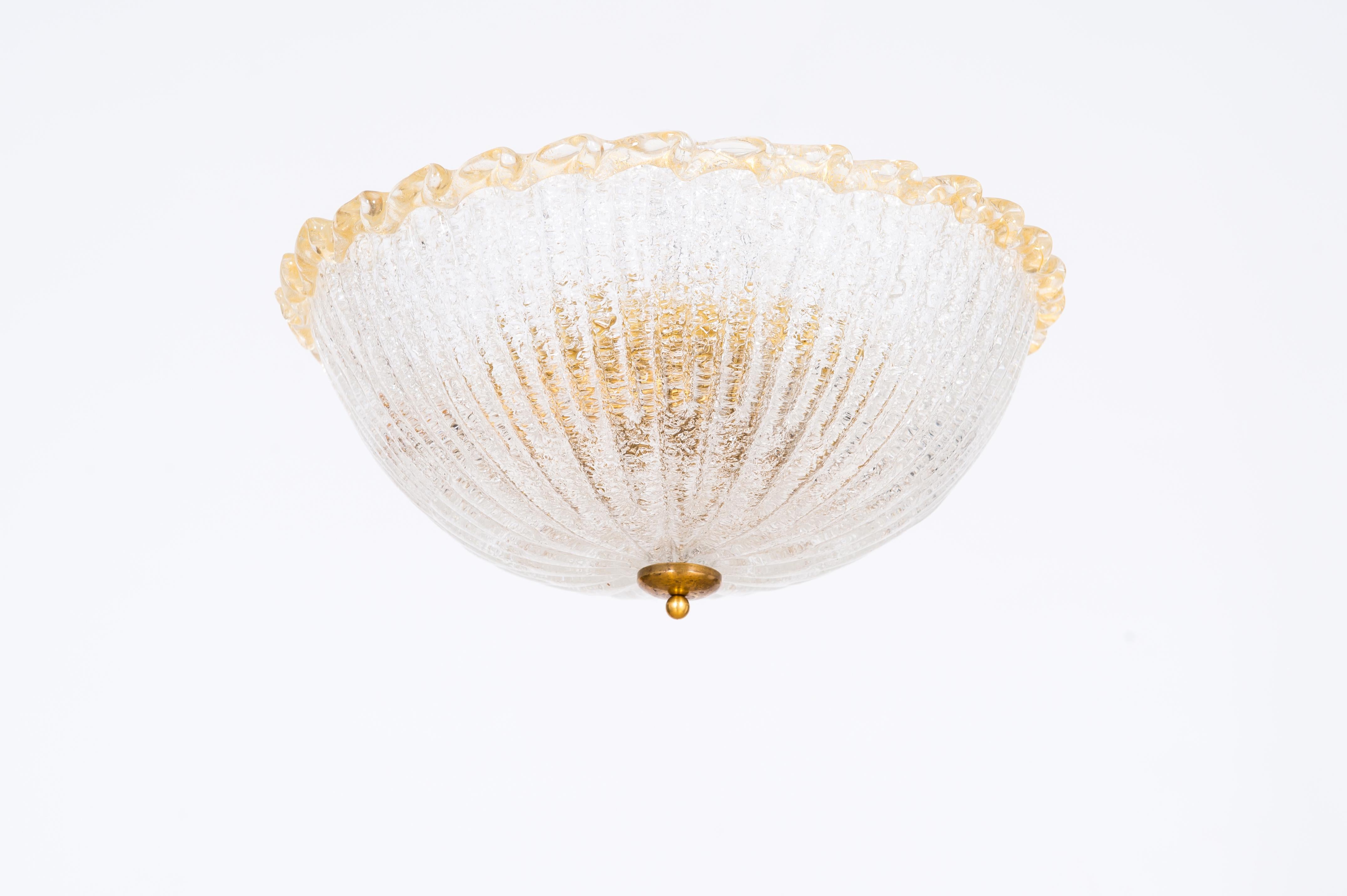 Italian Venetian Flush Mount in Blown Murano Glass with Gold Finishes 1980s
This refined piece of art will bring a unique touch of beauty into the room: it stands out for the high quality of its materials and the perfection of its details. It was