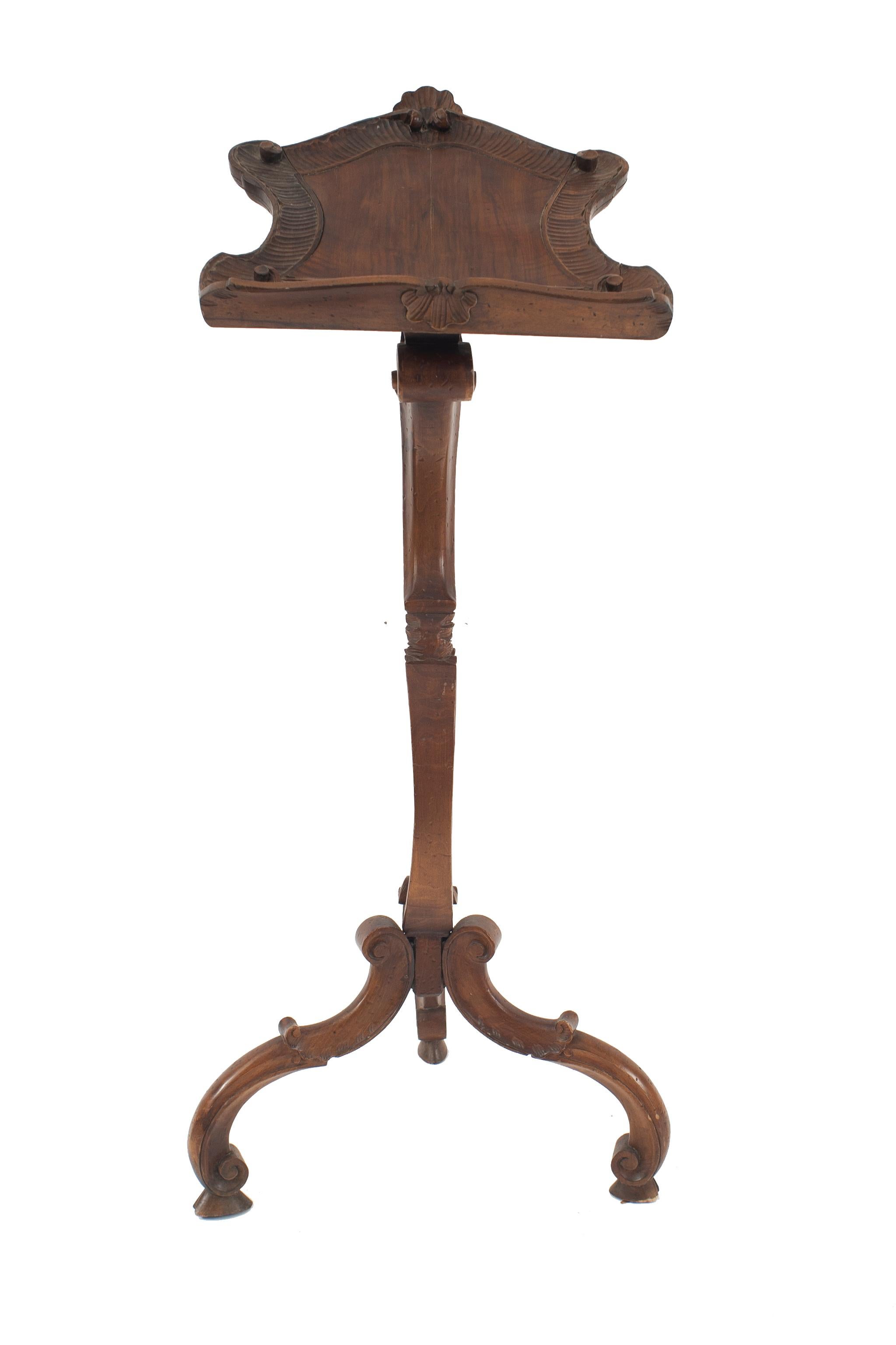 Italian Venetian Rococo Grotto style (18/19th Cent) lectern / music stand with a pedestal base with three legs and carved detail.
