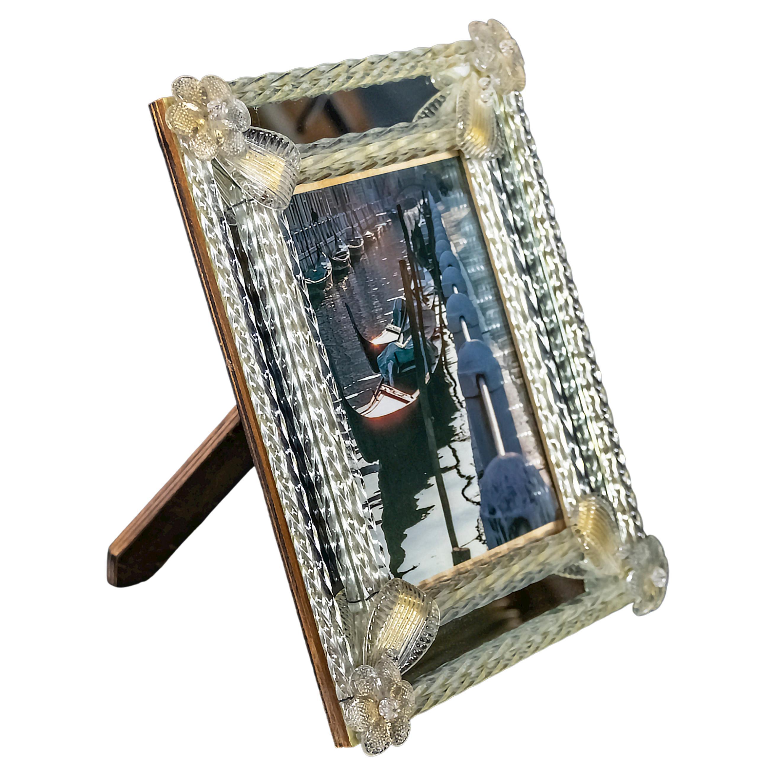 Italian Venetian handmade Murano glass photo frame from 1950-60's.
The glass is handmade, transparent with gold dust inside.
The frame can be hanged on the wall or placed on the table.

