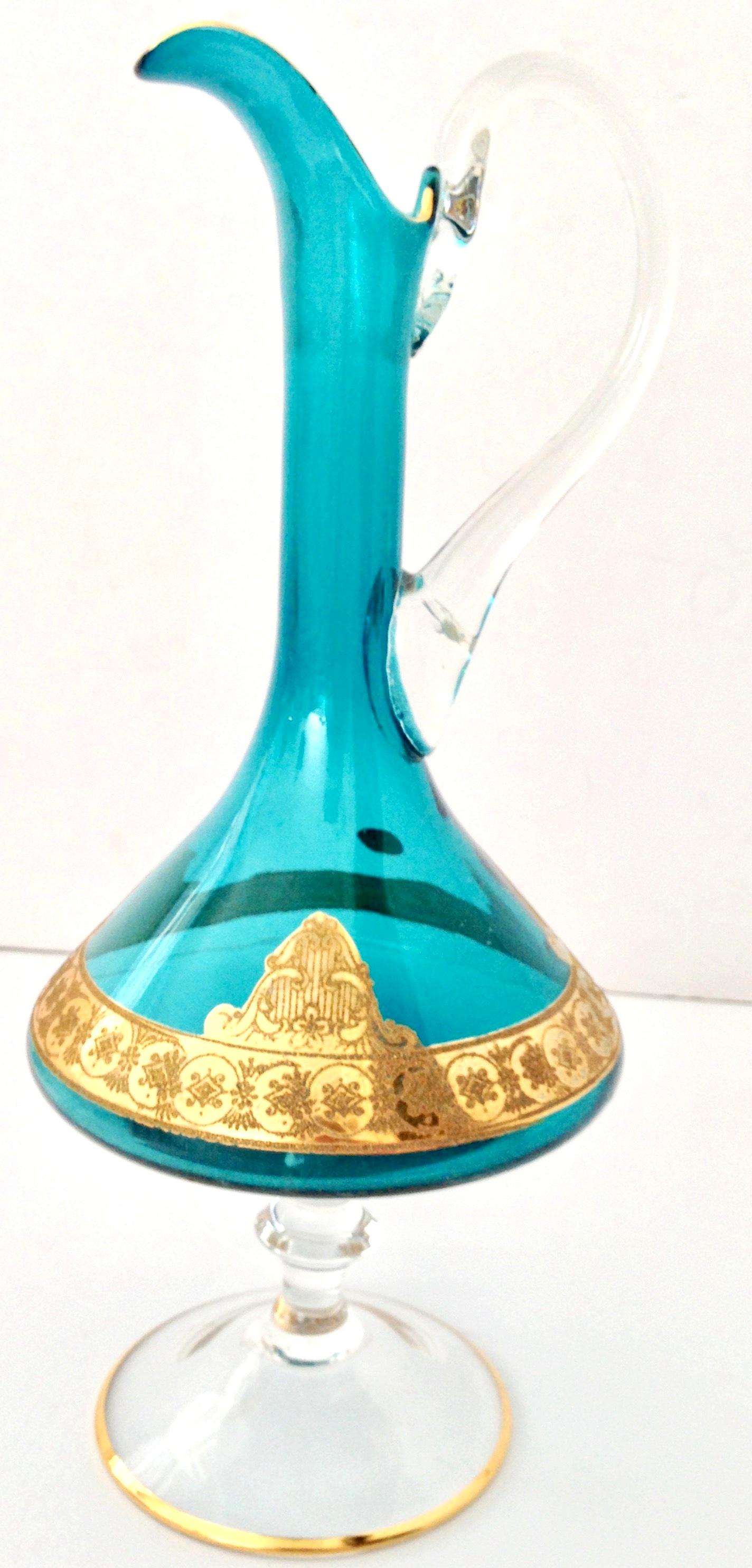 Mid-20th Century Italian Venetian Glass & 22K Gold Mediterranean Blue Footed Beverage Pitcher. The original manufacturer tag is present and reads, made in Italy.