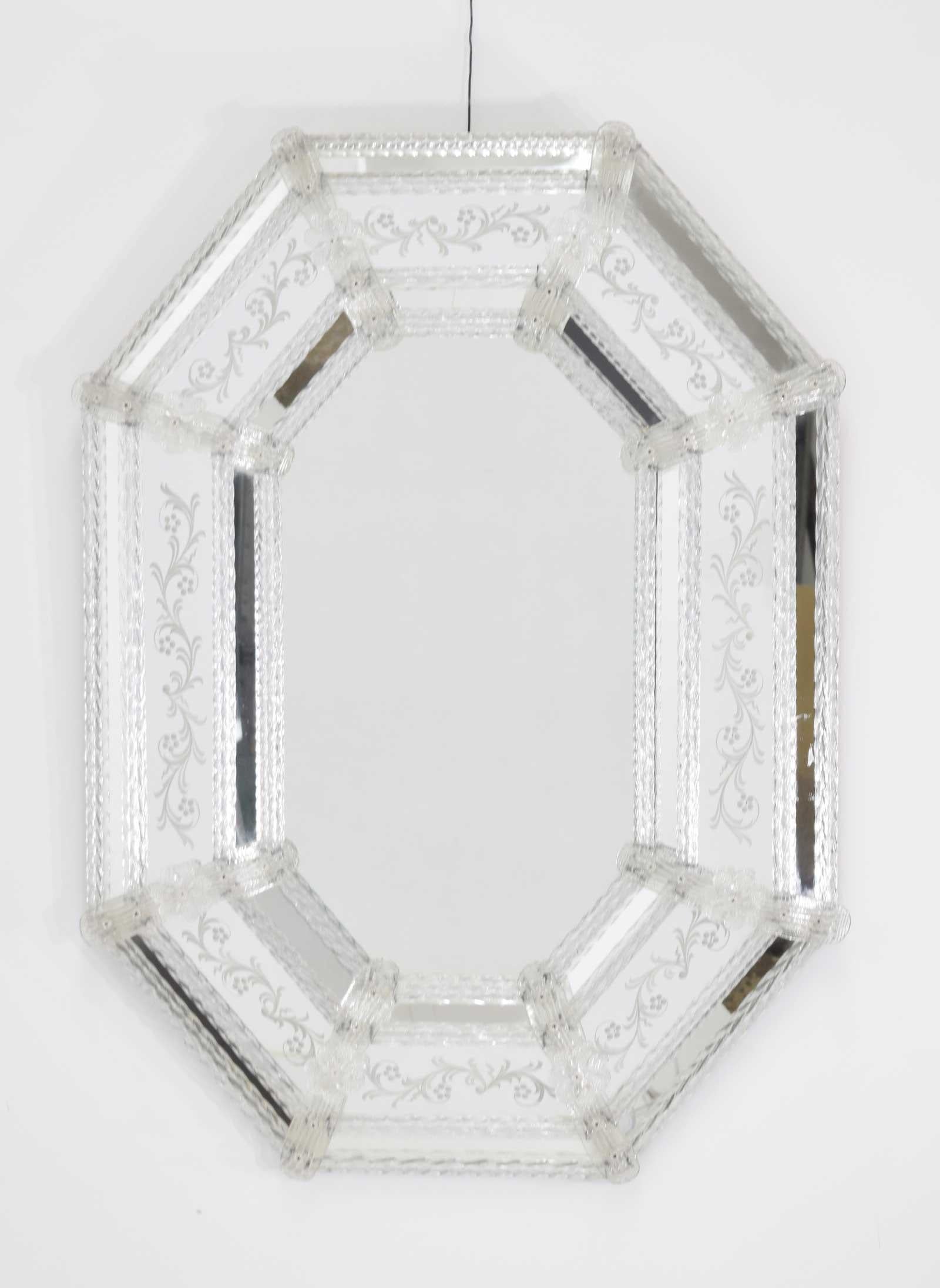 Stunning Venetian glass mirror with eight sides. Glass floral design, mirrored glass frames.