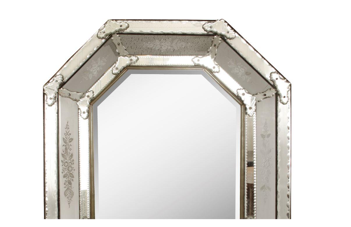 Octagonal Venetian cushion mirror with floral etched detail and applied mirror and glass accents.