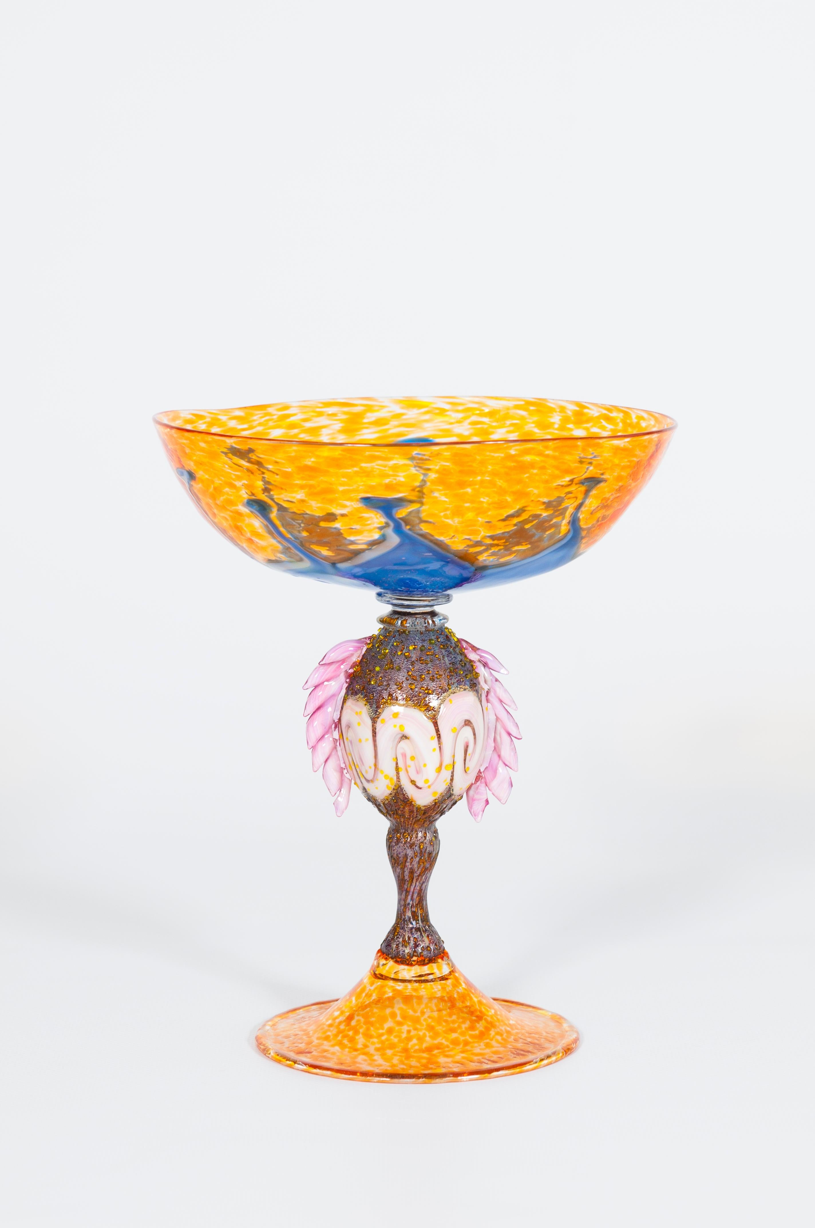 Italian Venetian Multicolor Murano glass goblet with Morise 1980s Handcrafted.
This unique Venetian goblet is a refined piece of art that stands out for its beauty, and for the richness and vividness of its colors. It was entirely handcrafted in