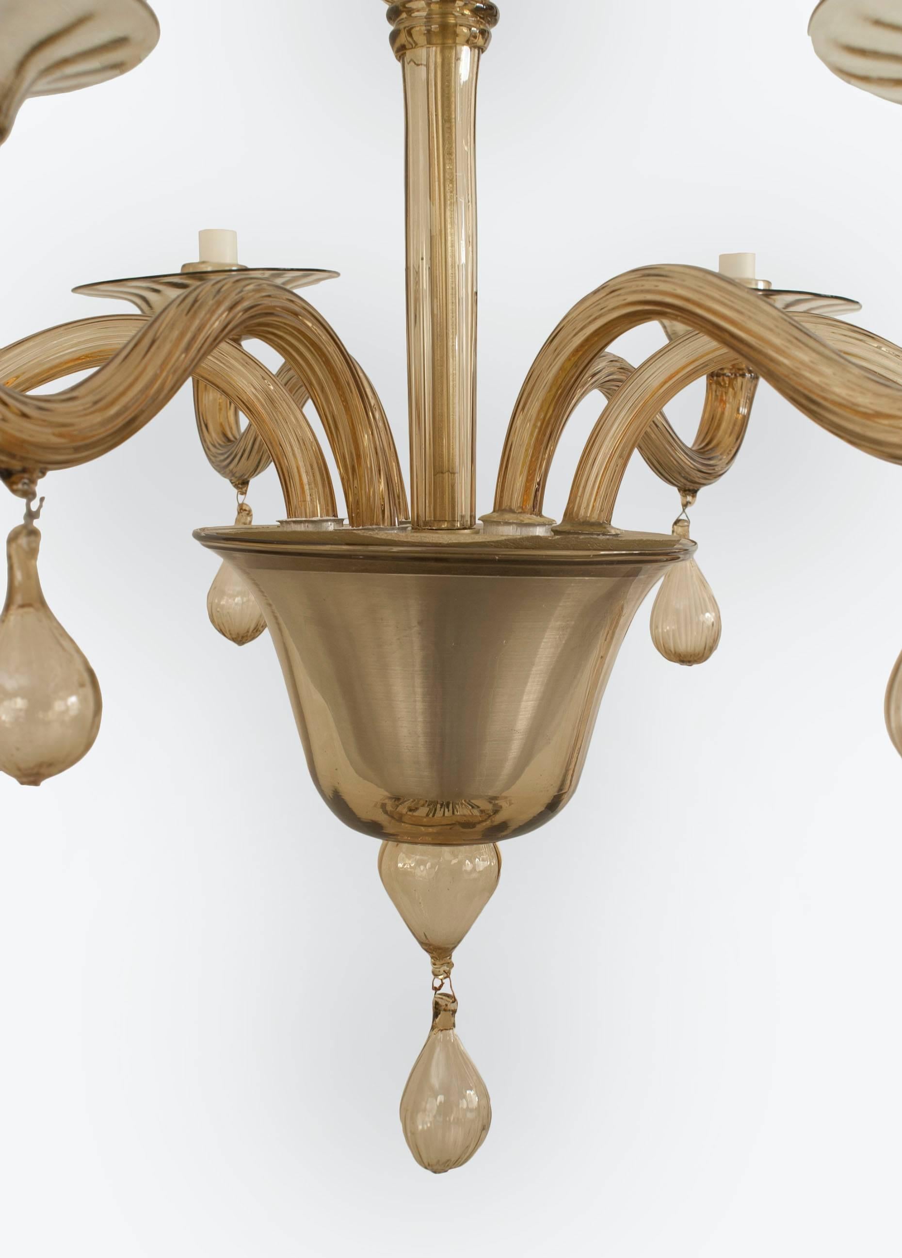 Italian Venetian Murano (1940s) style smoky amber glass chandelier with 6 scroll fluted arms with drops supporting round disc shades emanating from a tiered centerpost & finial bottom.
