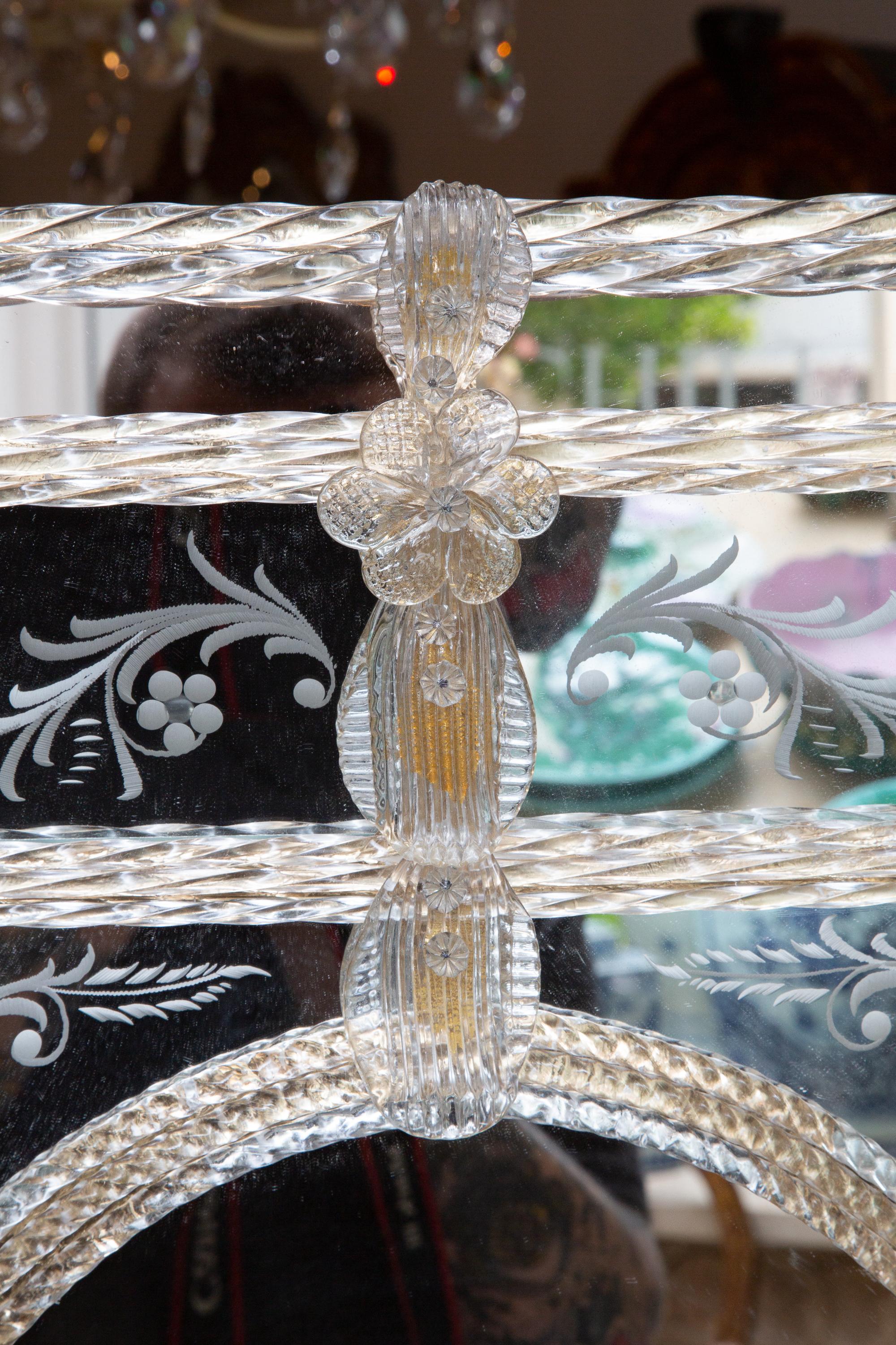 This is a lovely classic Italian Venetian mirror with etched glass and molded roping and flower heads. 20th century.