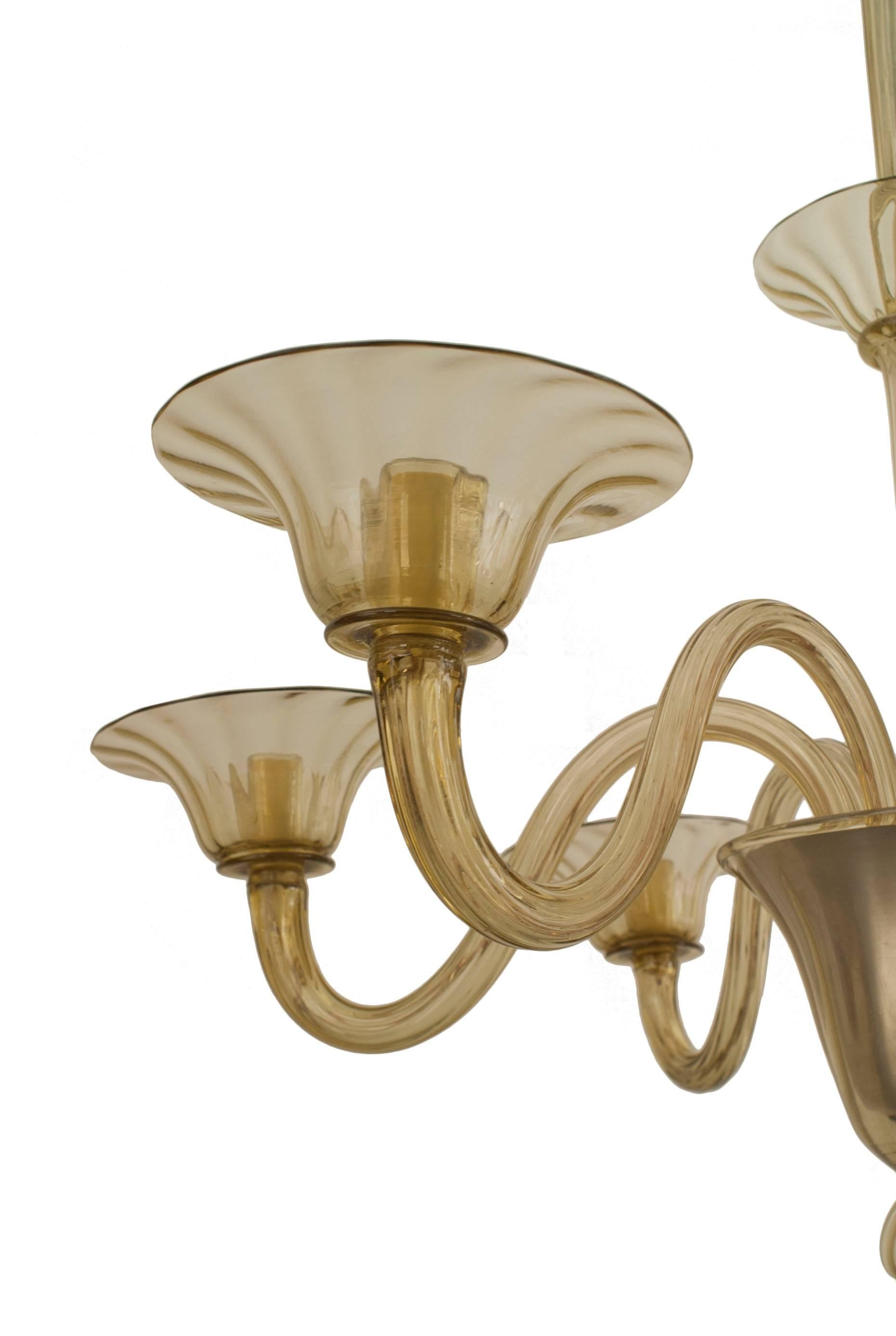 Italian Venetian Murano chandelier with 6 smoky tinted scroll arms supporting flared fluted shades and emanating from a 3 tiered center post with a finial bottom.
